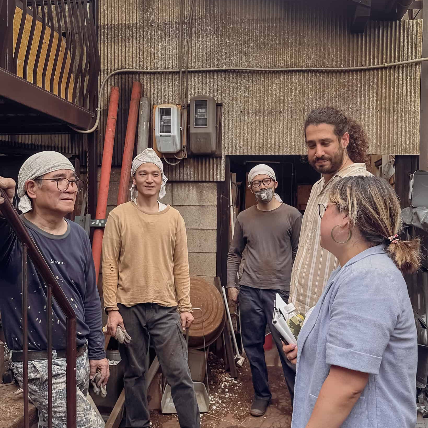 Group of people from Gud knife in the famed blacksmith workshop of Yoshi Kazu Tanaka San