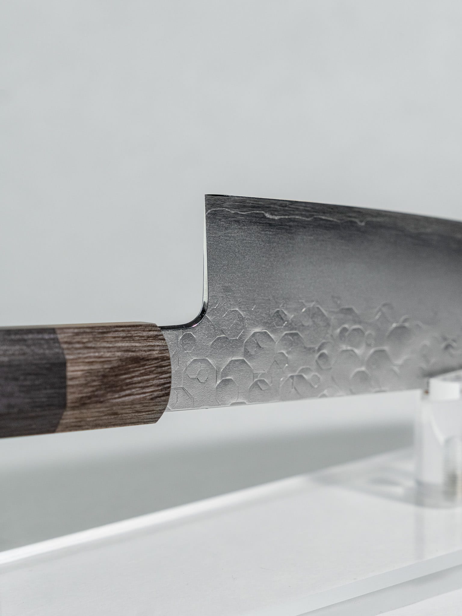 
Side profile of Hado Shiosai Ko-Bunka 135mm blade showing k-tip geometry and stainless tsuchime cladding