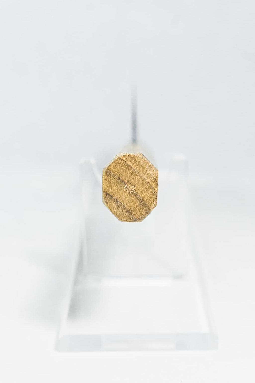 Octagonal darkened oak wa-handle on 165mm Santoku with a maker's stamp