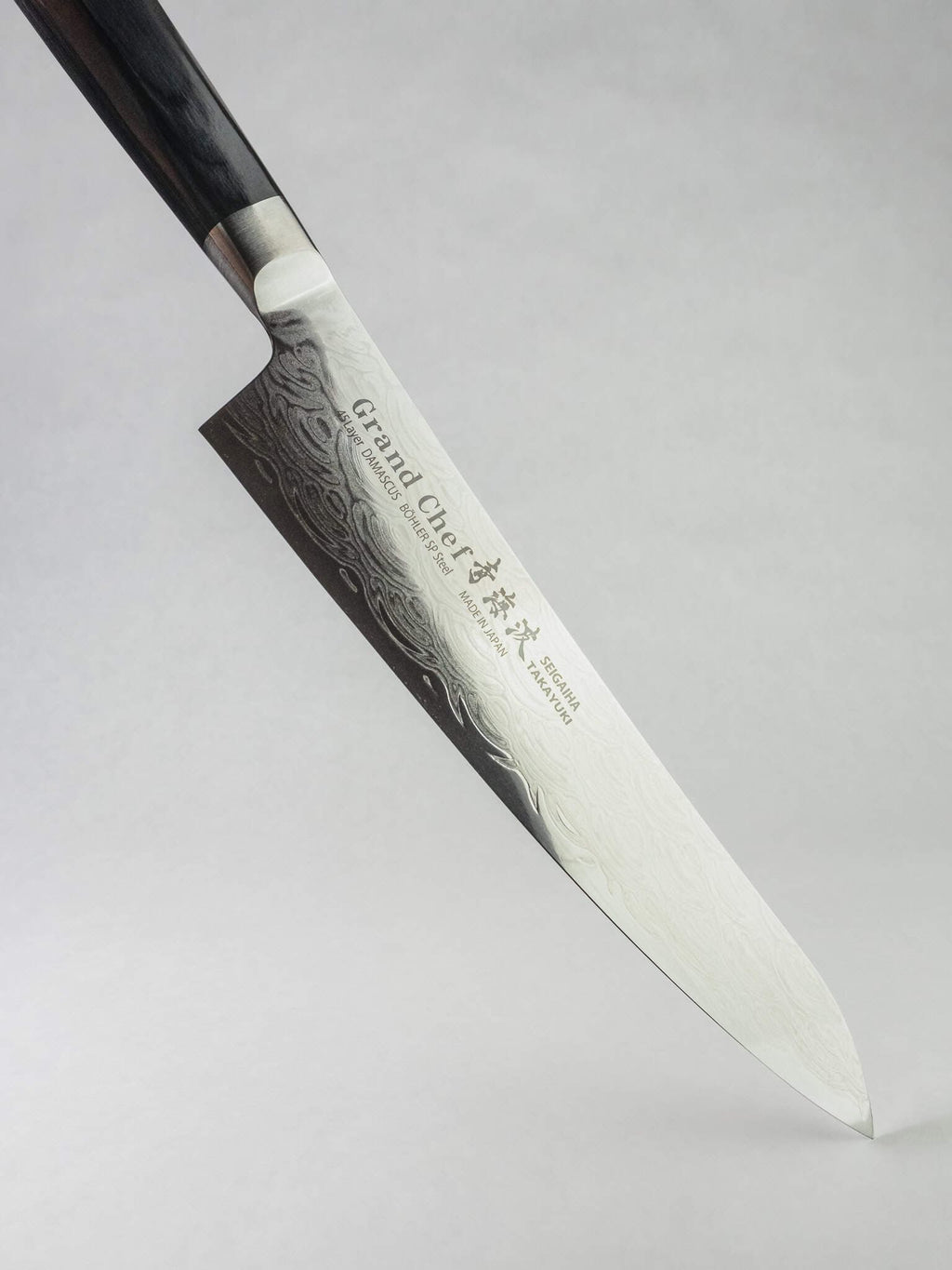 Seigaiha wave Damascus pattern on Sakai Takayuki Gyuto