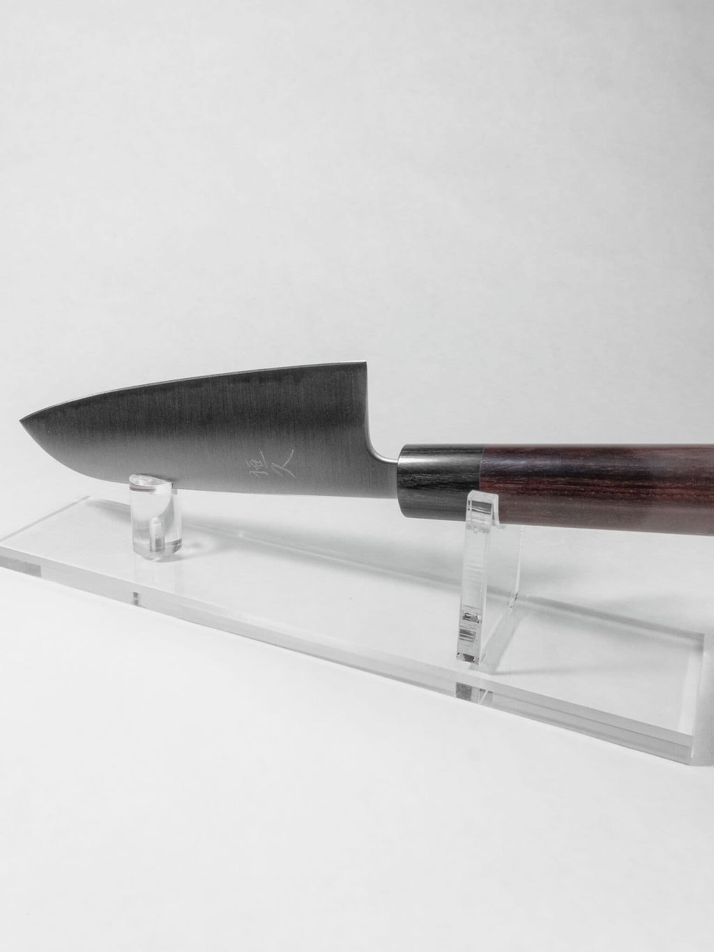 165mm Santoku knife for vegetables, meat and fish against a white background.