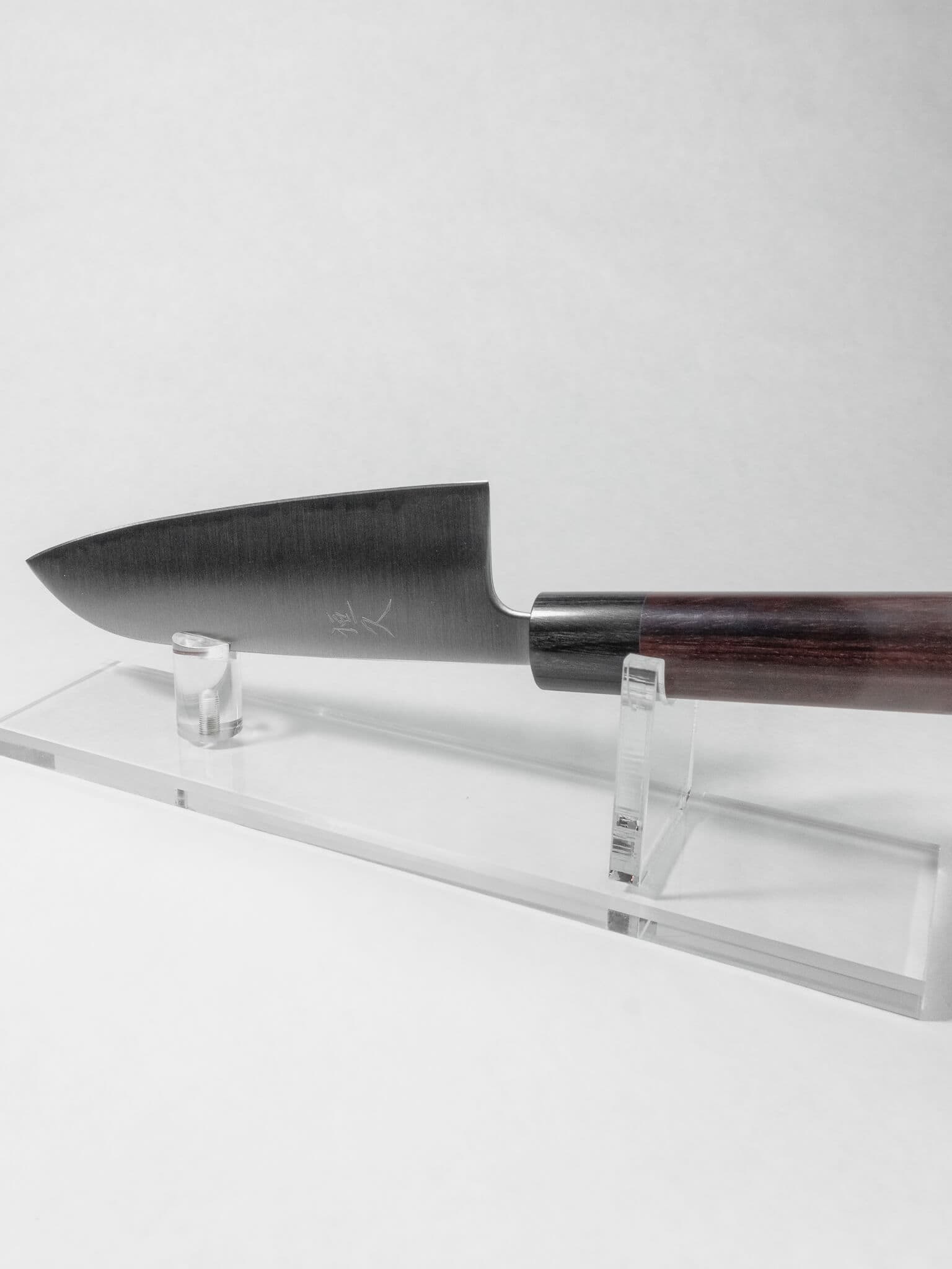 165mm Santoku knife for vegetables, meat and fish against a white background.