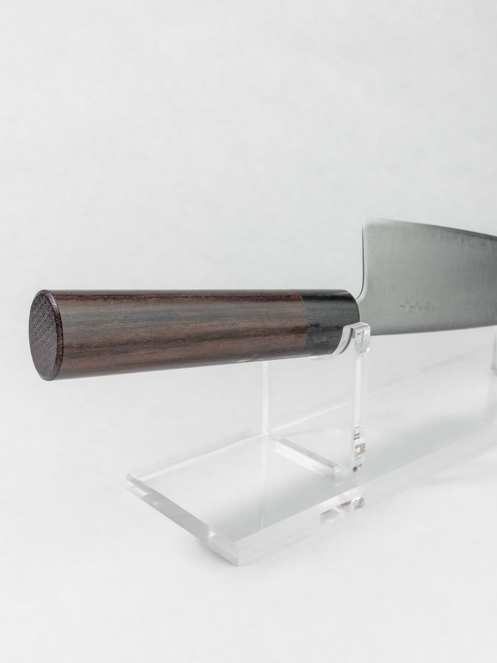 Oval rosewood handle Japanese Santoku knife for a comfortable and lightweight grip.