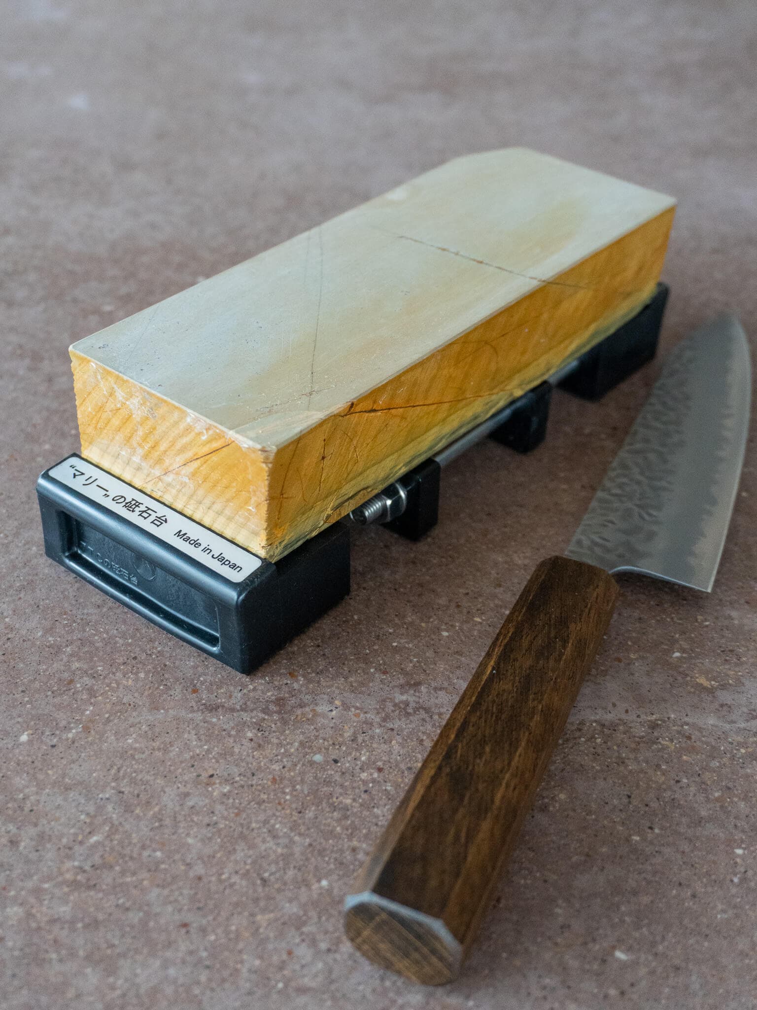 Stone holder stabilizing sharpening stone during use