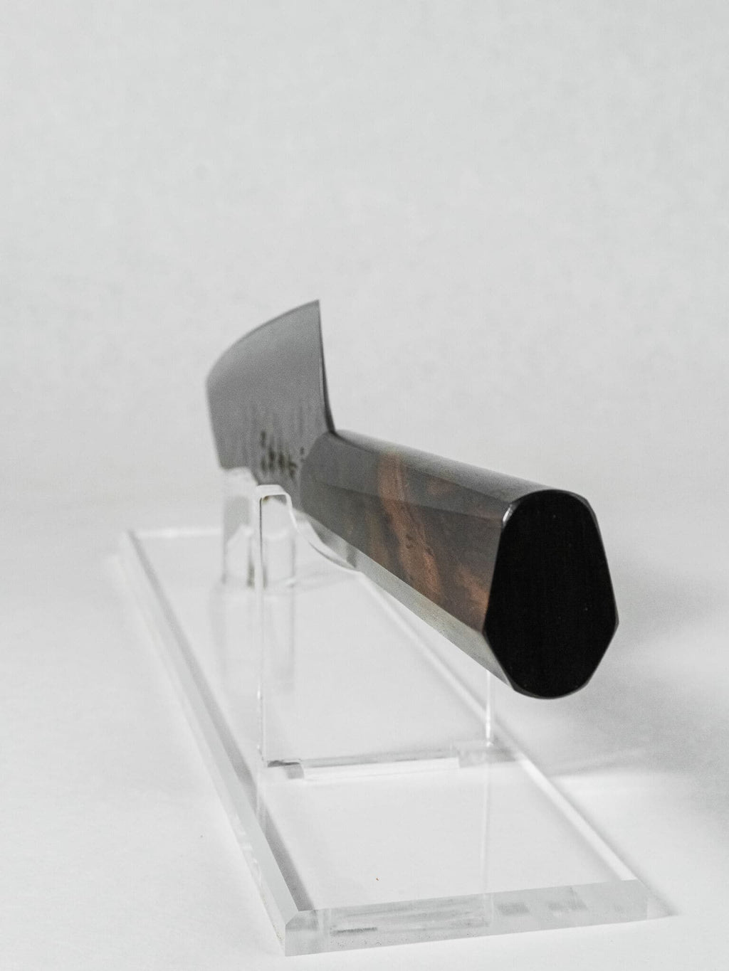 Hybrid octagonal ebony handle on Sakai Takayuki Kengata knife shown from the back.