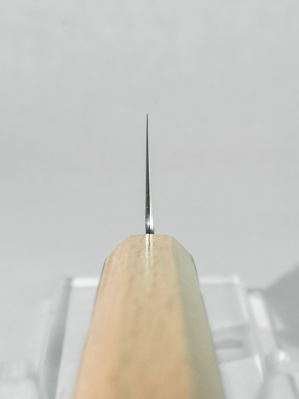 Choil shot revealing thin grind and SG2 core steel on the HADO ko-bunka