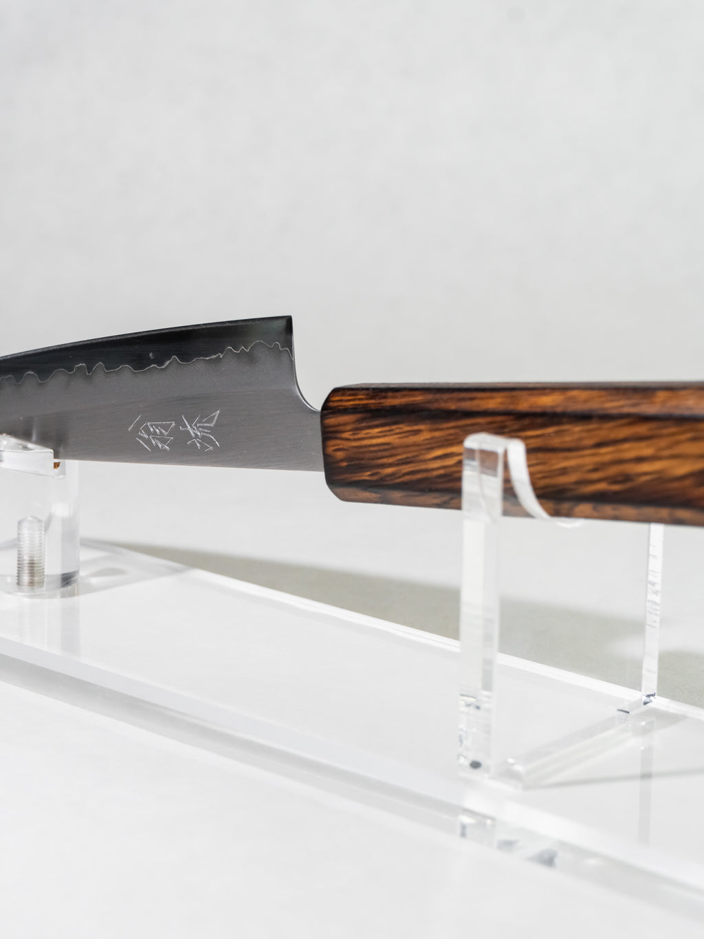 Side profile of OUL 135mm petty knife showing full blade and octagonal darkened oak handle.
