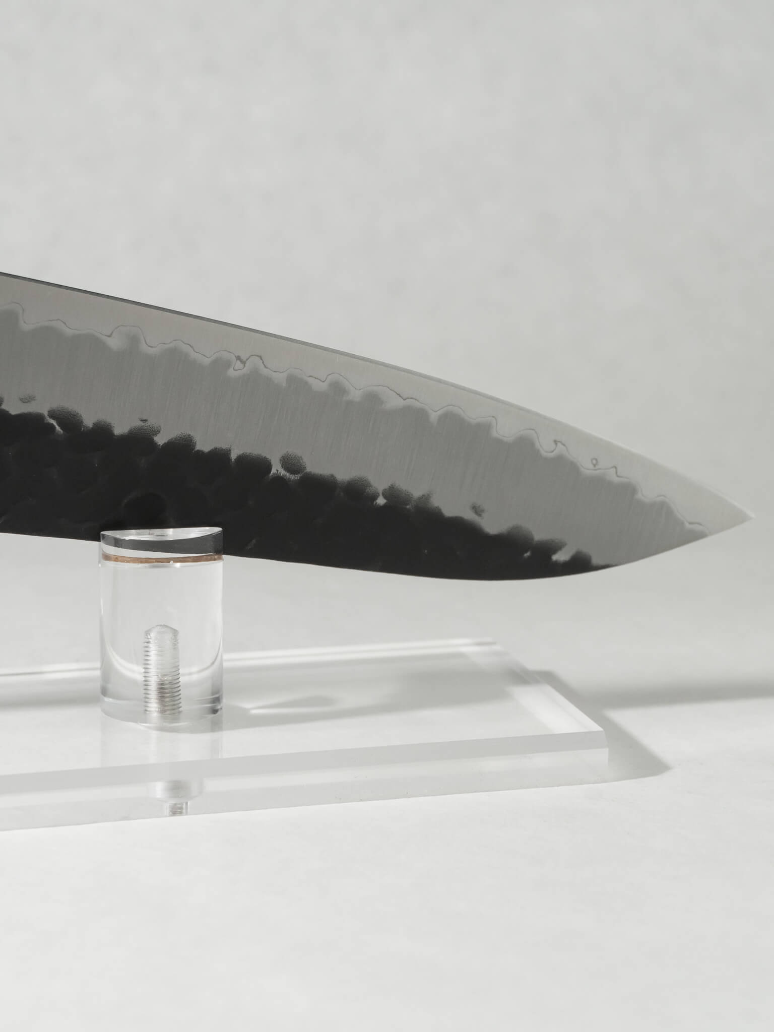 Close-up of OUL Gyuto tip showing the precise  point and the edge kasumi.