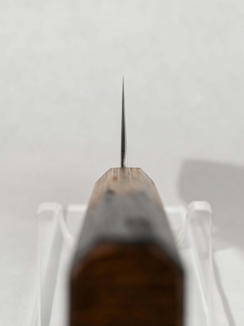 Choil close-up on OUL Ginsan Gyuto for enhanced control and smooth pinch grip.
