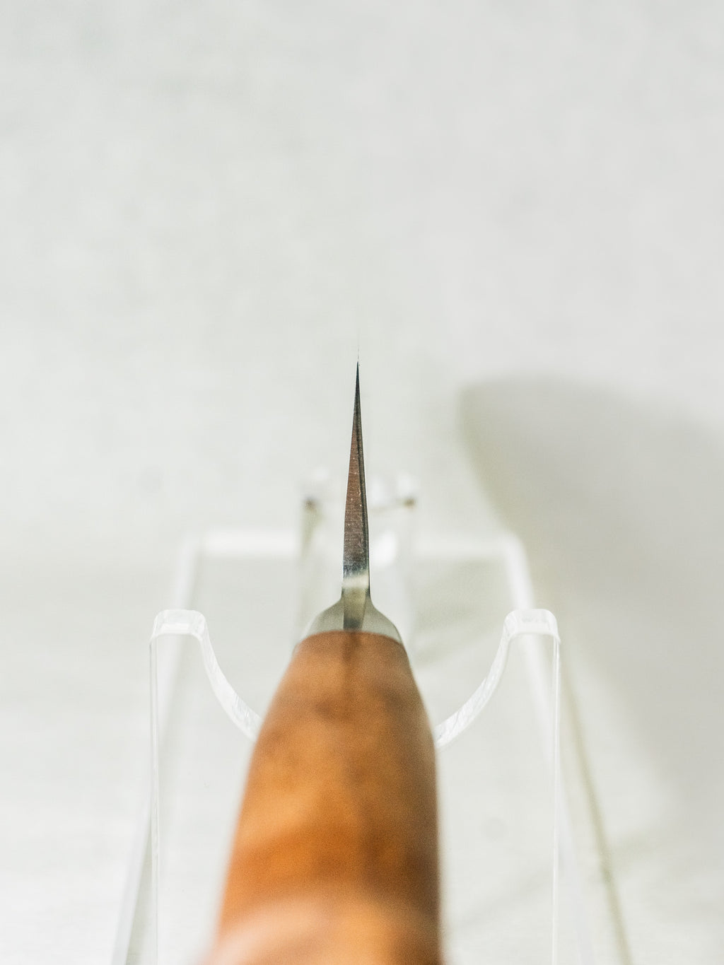 Choil view showing thin grind and balance of the OUL Japanese gyuto knife