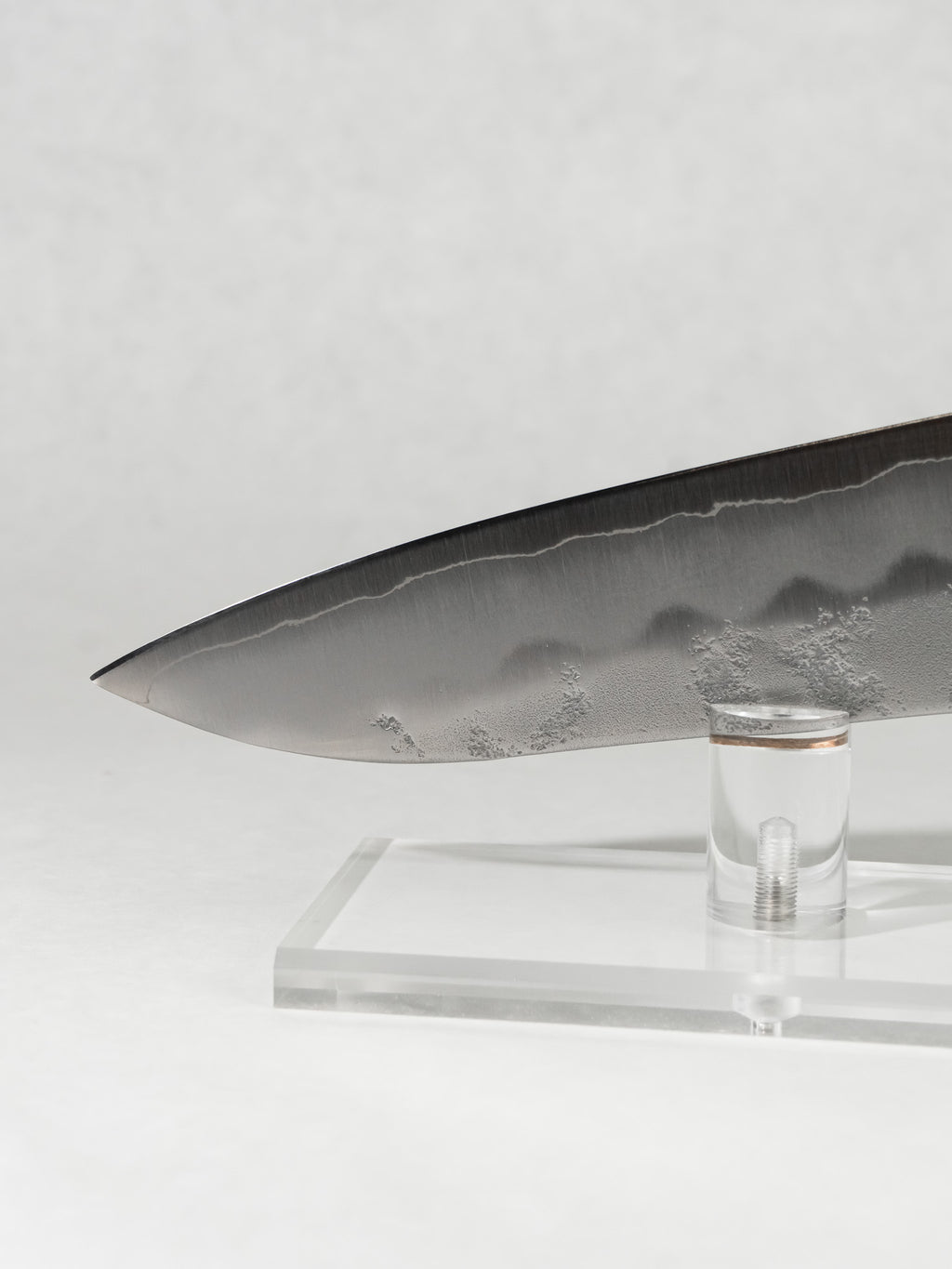 Gyuto tip close-up showing precise geometry for slicing and detailed prep work.