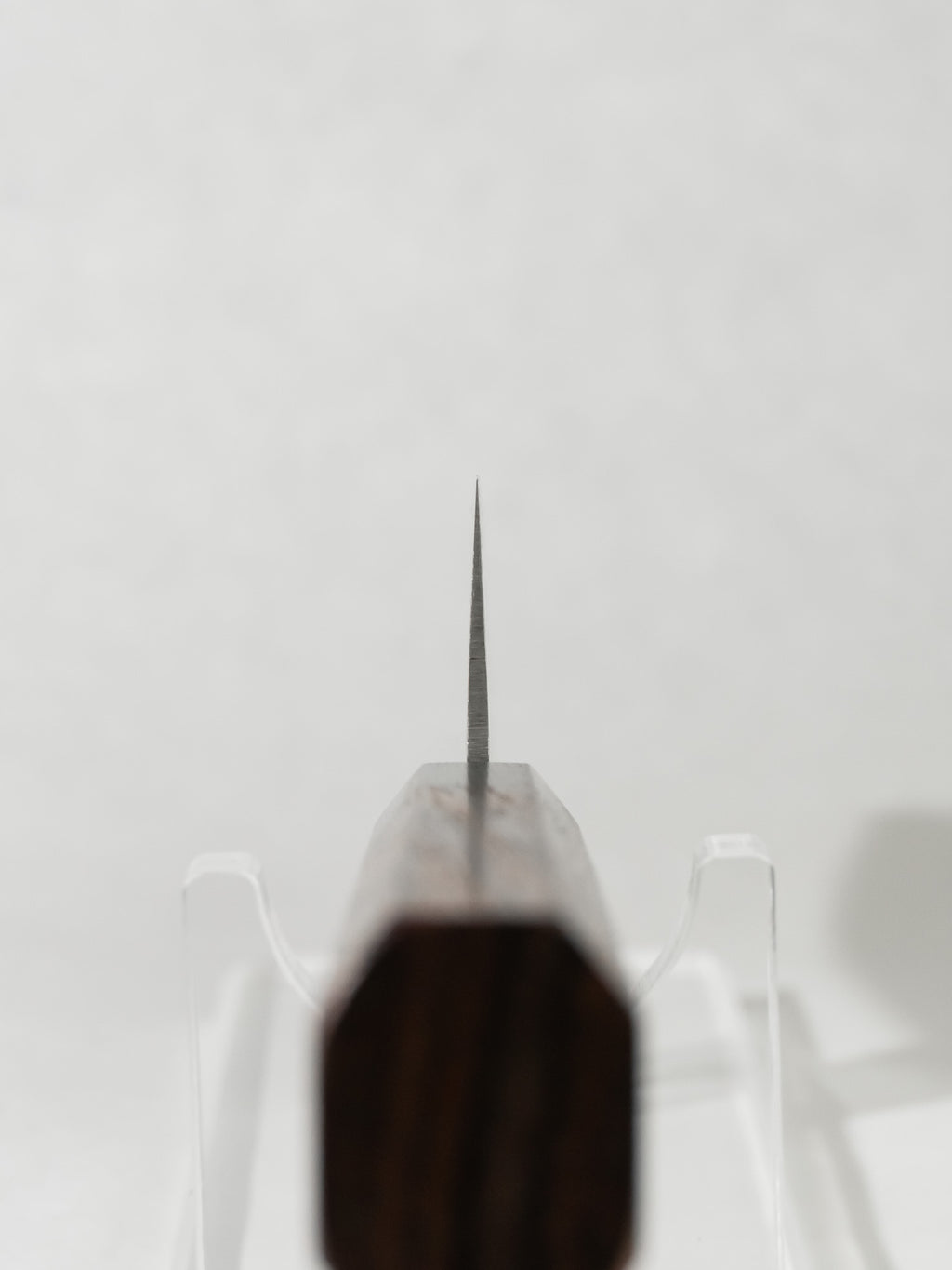 Choil close-up showcasing smooth transitions for a comfortable pinch grip and precise control.