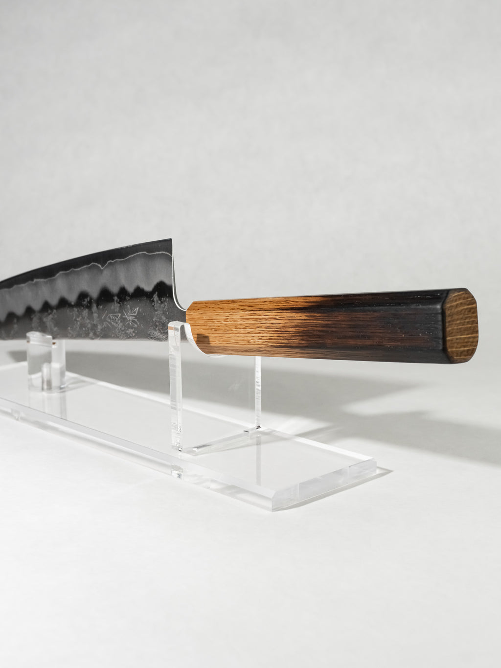 Close-up of octagonal burnt oak handle offering balance, comfort, and secure grip.
