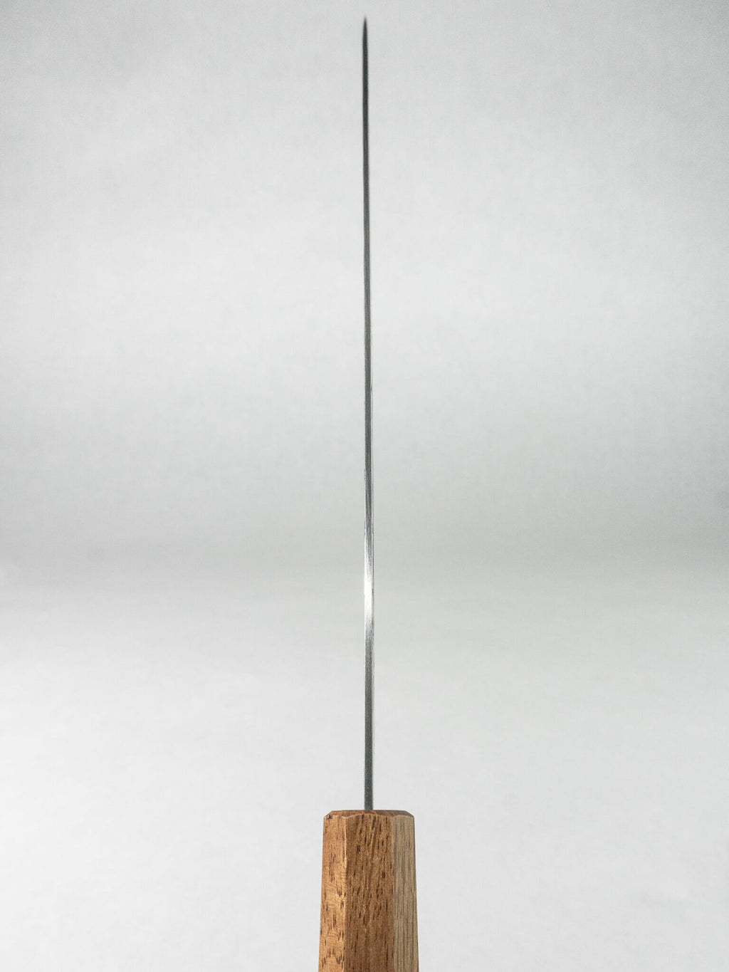 Spine detail showing slim blade thickness and balance