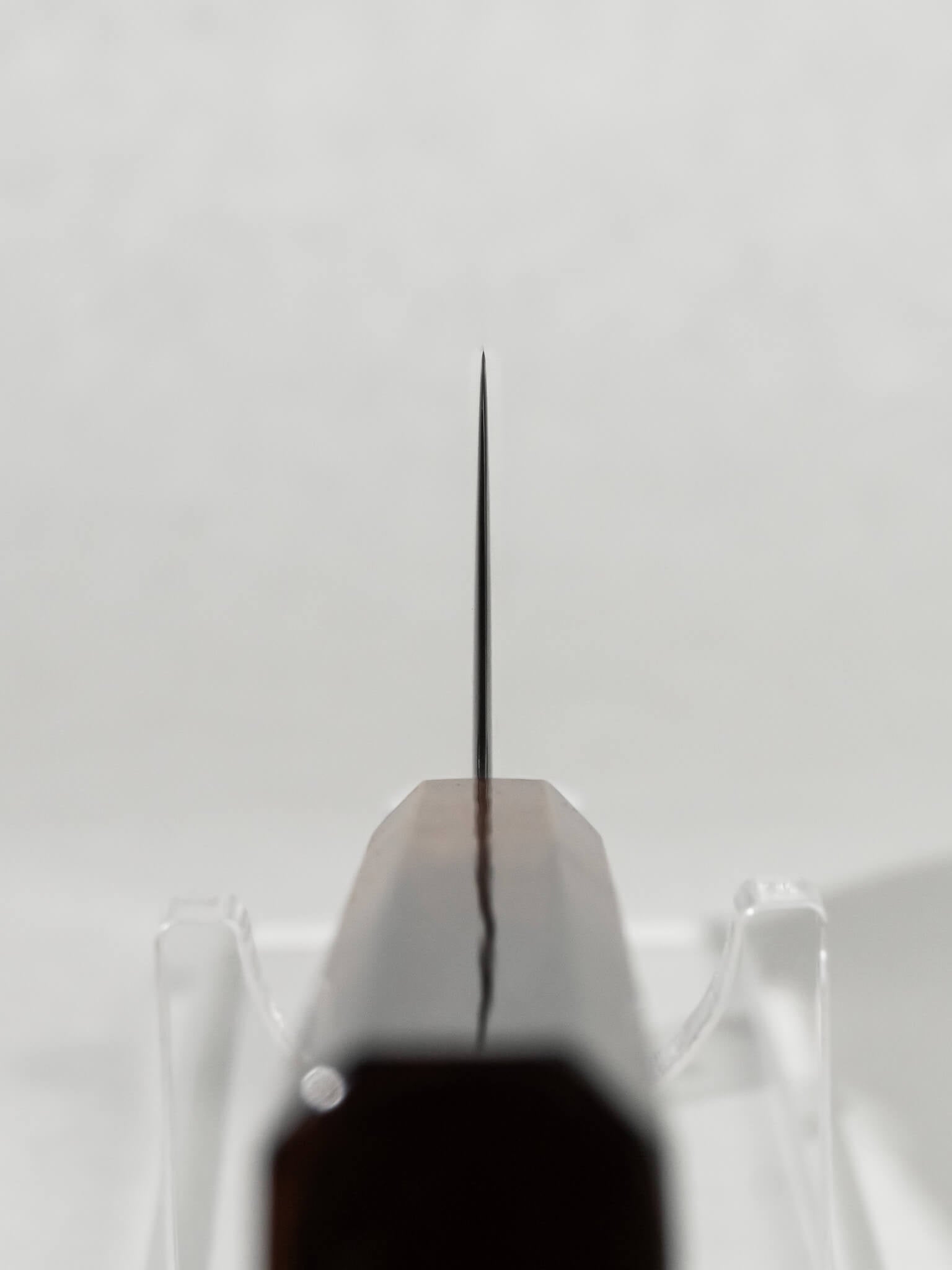 Close-up of the OUL 165mm Uzu Nakiri choil and polished spine showing meticulous craftsmanship.