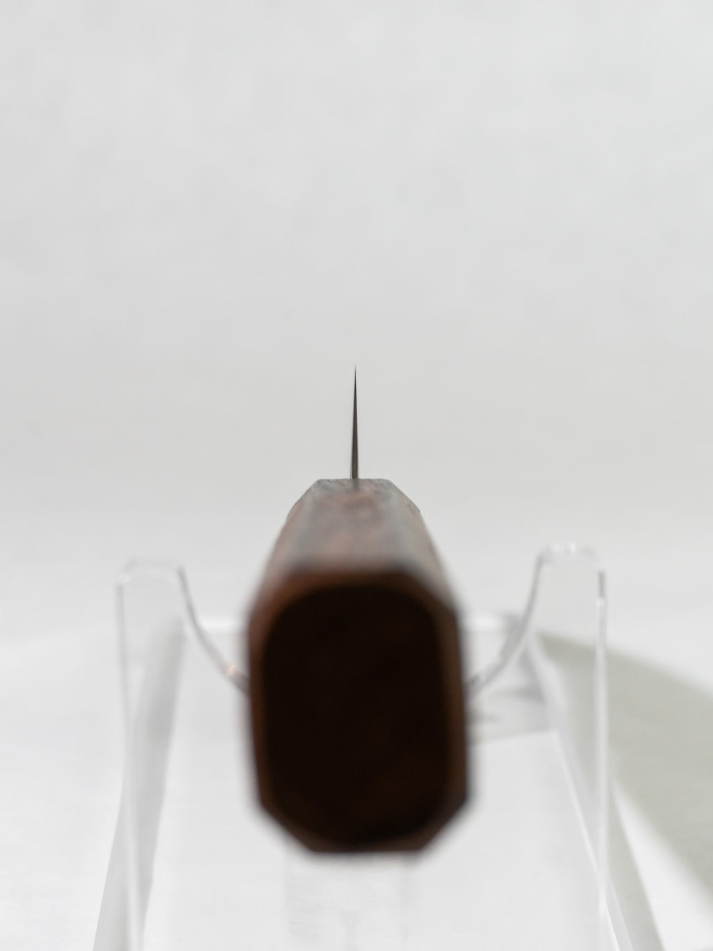 Close-up of OUL petty knife choil showing precise Japanese craftsmanship.
