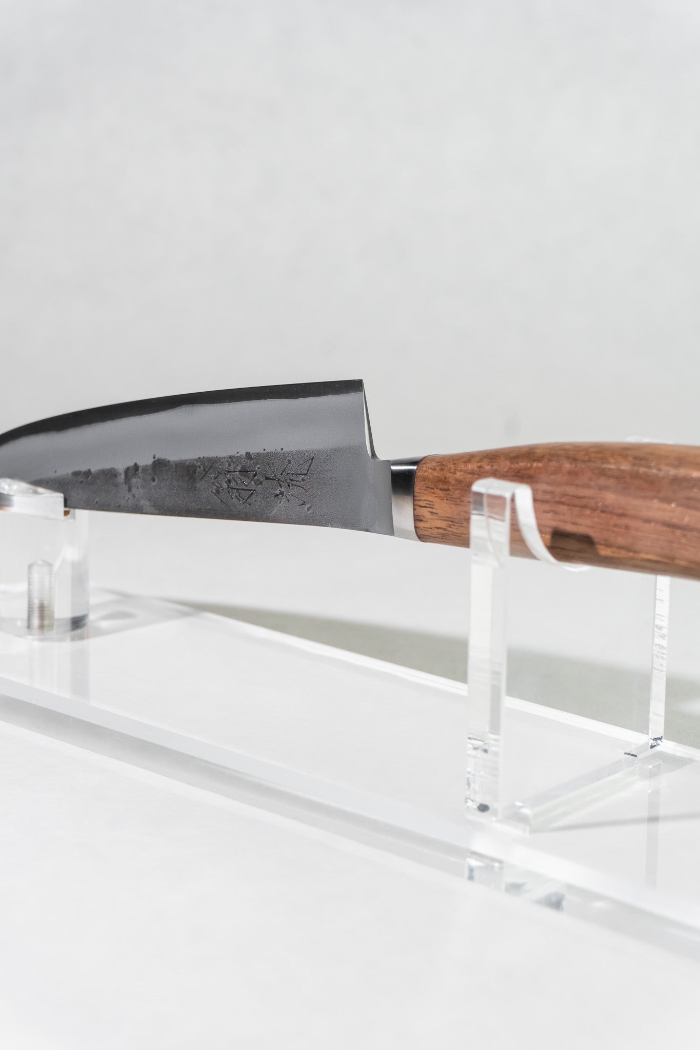 Angled view of OUL petty knife emphasizing balance, thin blade, and traditional Japanese design.