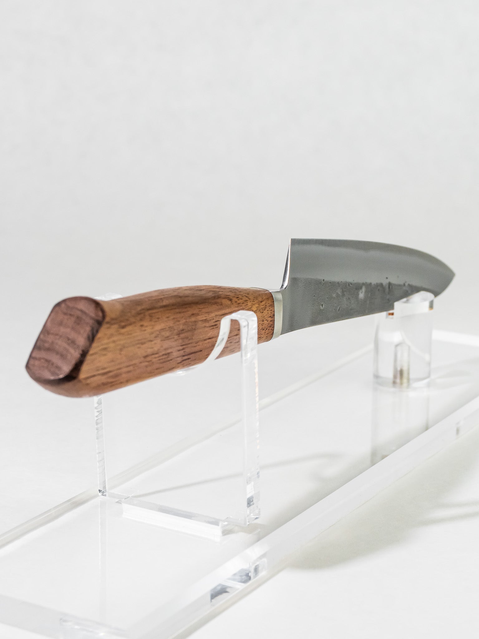 OUL petty knife handle close-up in Western walnut with integrated bolster for balance and comfort