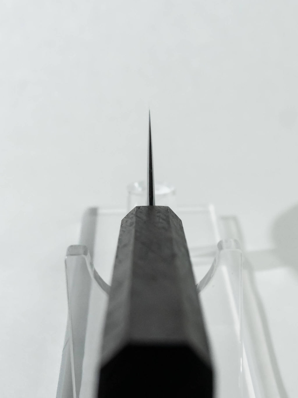 Close-up of the OUL Santoku choil  highlighting the expert blade geometry and knife craftsmanship.