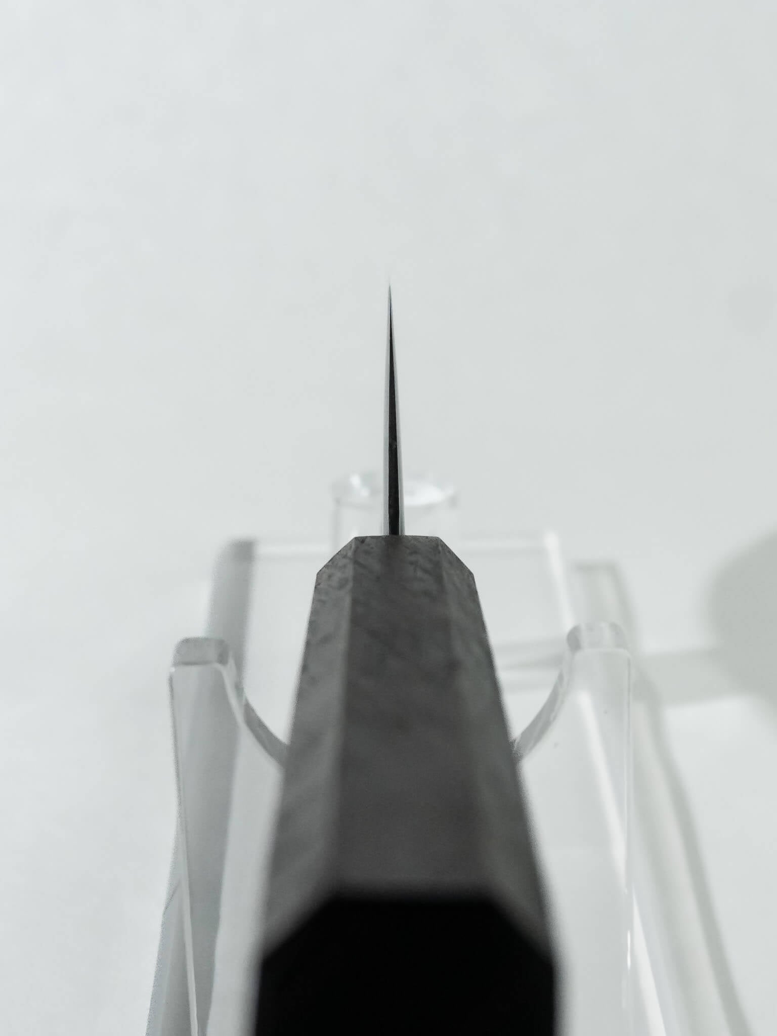 Close-up of the OUL Santoku choil  highlighting the expert blade geometry and knife craftsmanship.