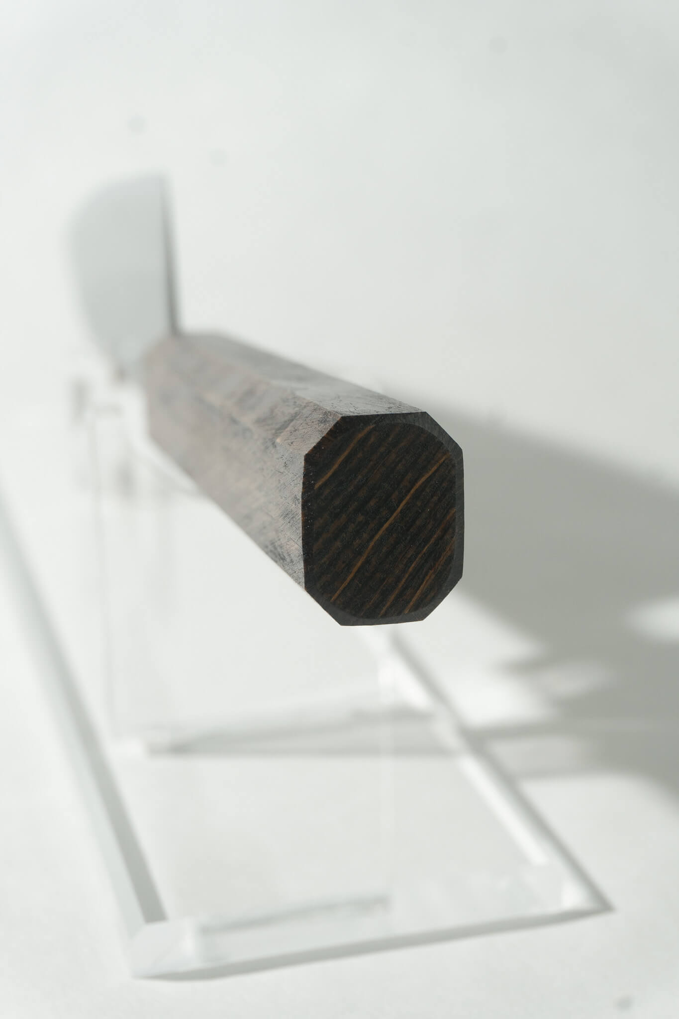 OUL Santoku knife handle in octagonal darkened oak for comfortable grip and balance.