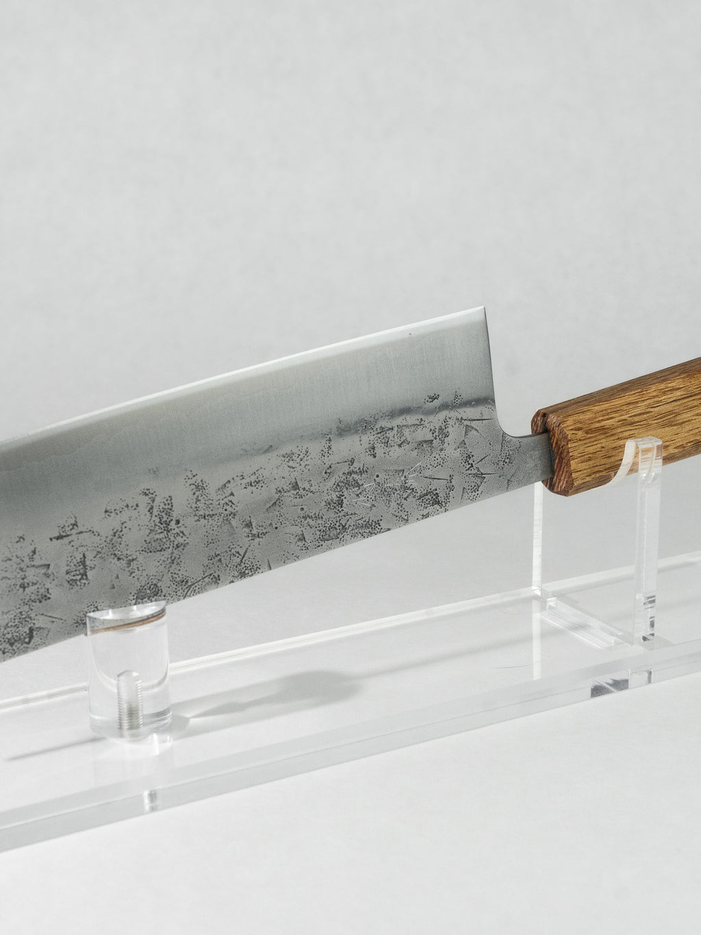 Close-up of the stainless nashiji finish on the OUL SLD Nakiri, highlighting its pear-skin texture and refined look.