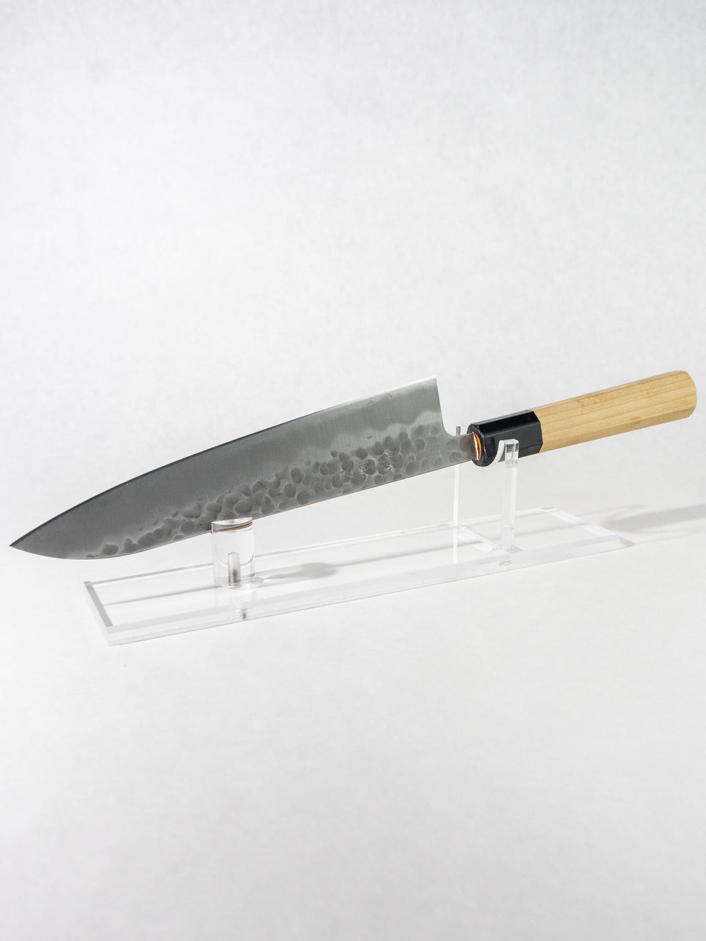 OUL 210mm Gyuto knife with White #2 steel core, hand-hammered tsuchime blade, and octagonal magnolia handle with buffalo horn ferrule.