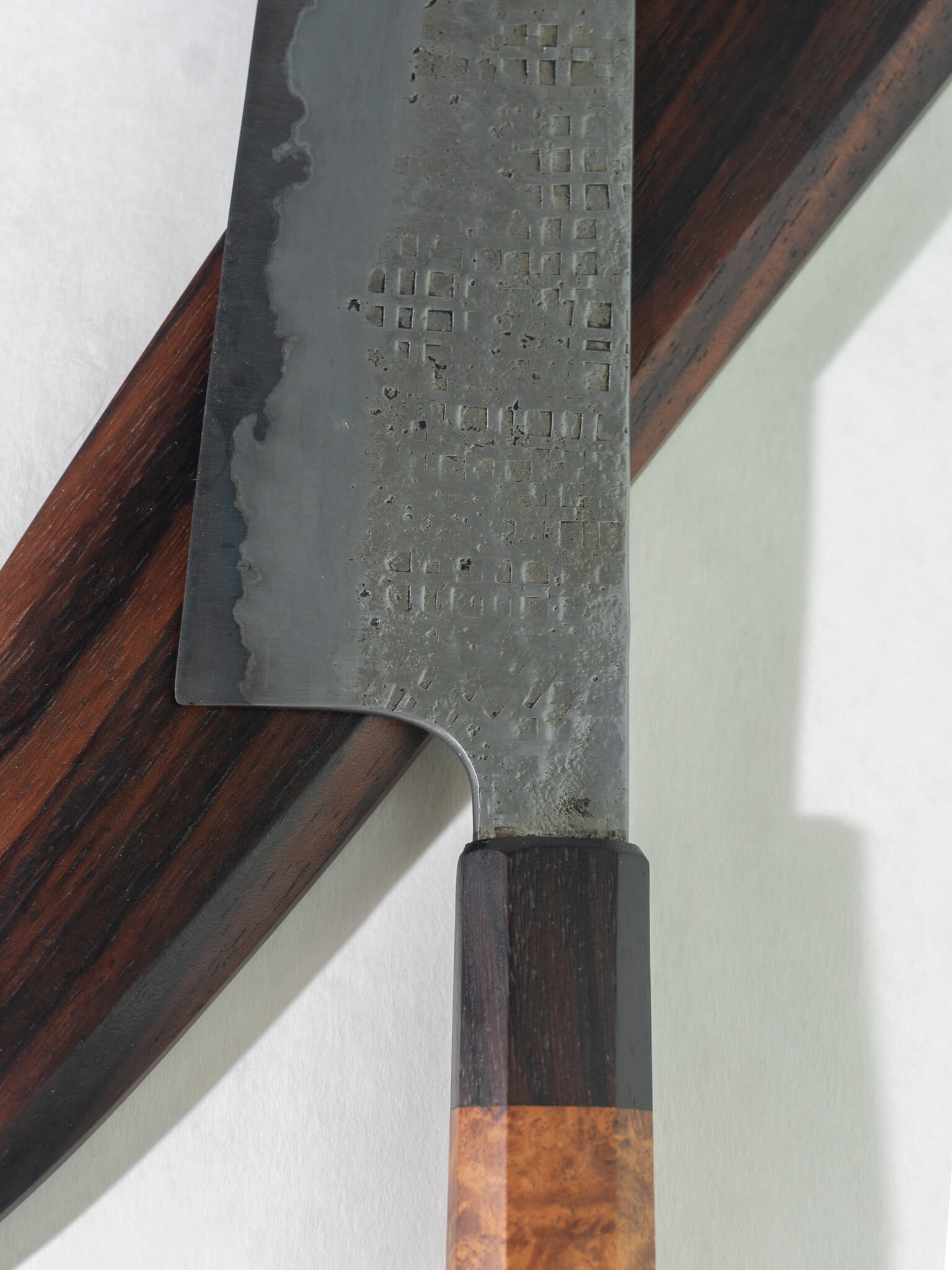 Close up of Pisau Dapur gyuto knife 230mm featuring a sharp, well-balanced blade and a smooth rosewood handle, paired with a matching rosewood saya for safe storage and blade protection.