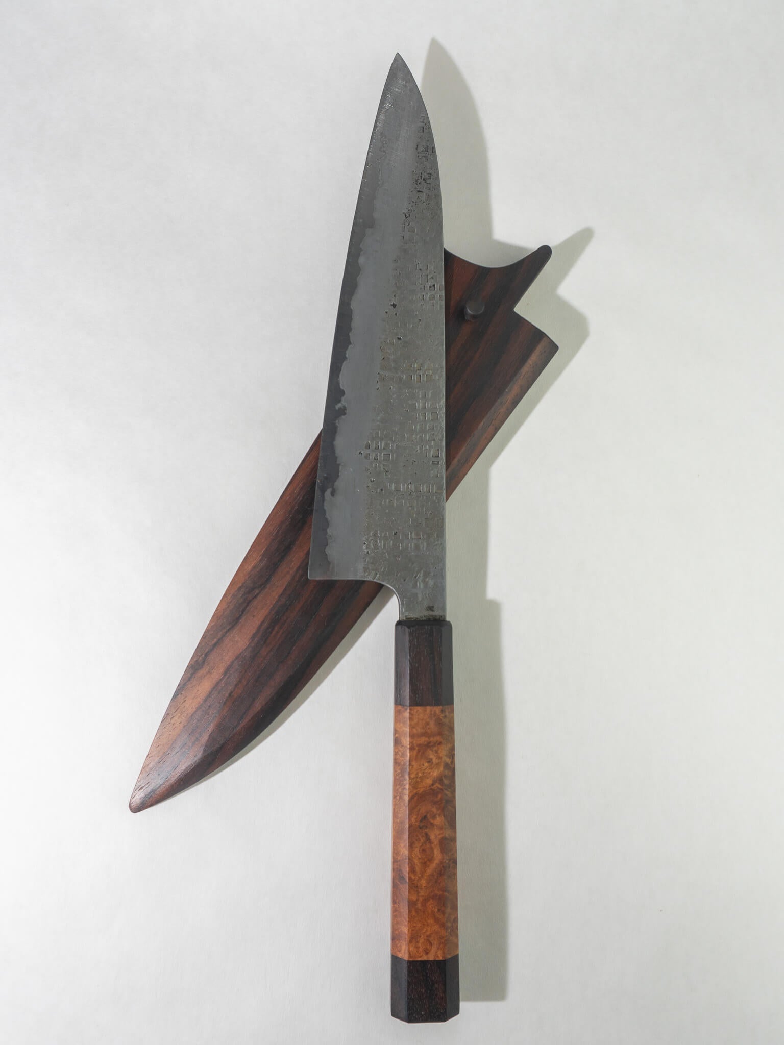 Pisau Dapur gyuto knife 230mm featuring a sharp, well-balanced blade and a smooth rosewood handle. Paired with a matching rosewood saya or protective wooden sheath.