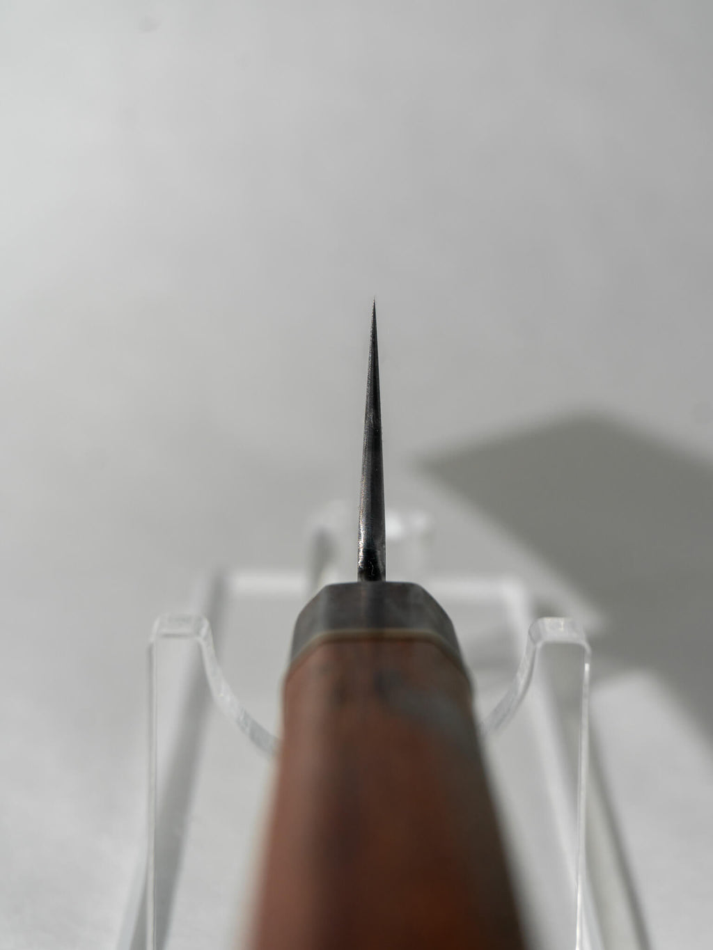 Choil close-up revealing the refined grind of the L6 Honyaki Sakimaru for smooth, controlled slicing.