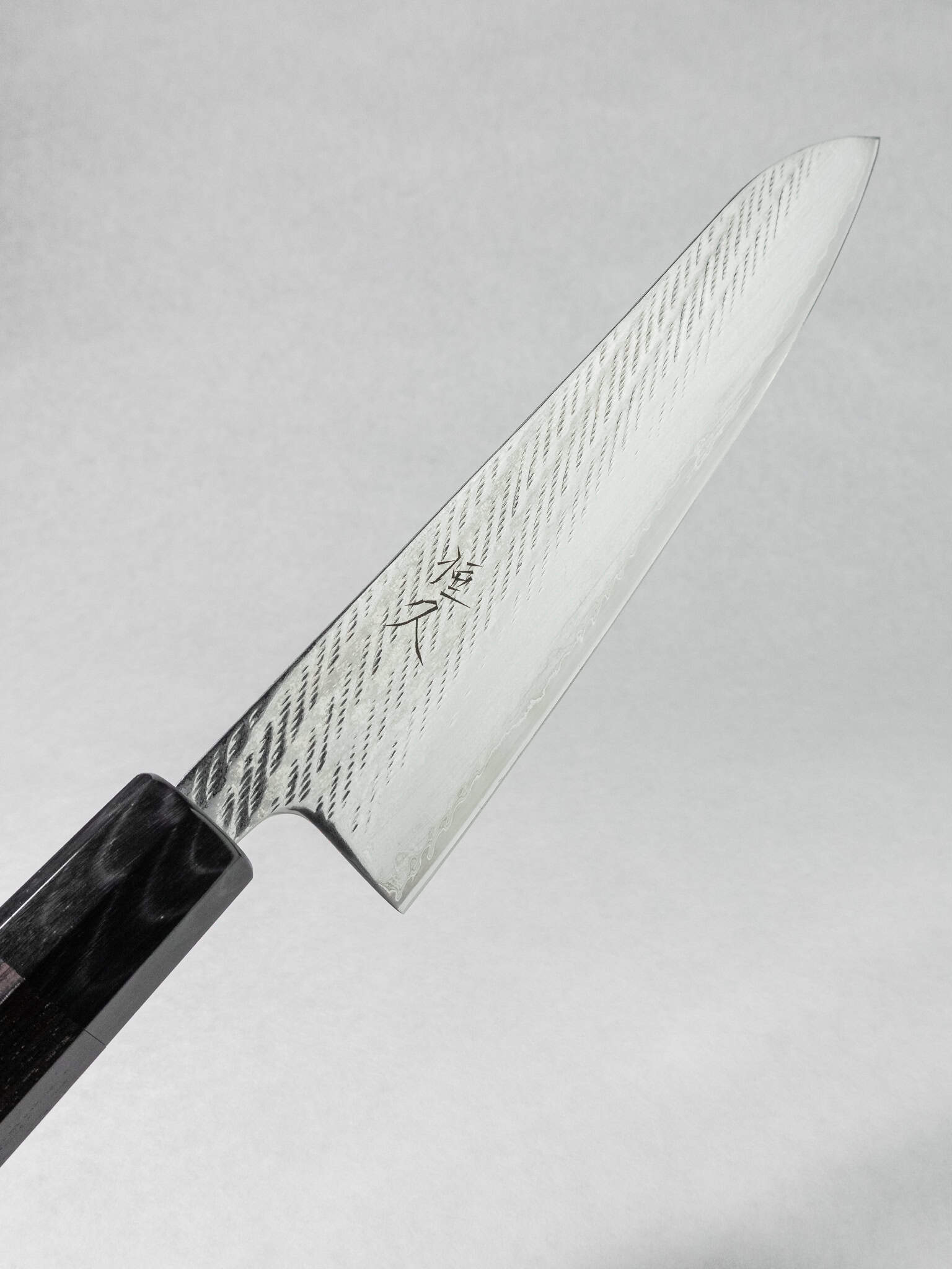 Premium stainless Ginsan Gyuto knife for home and professional kitchens, handcrafted in Tosa Kochi Japan.
