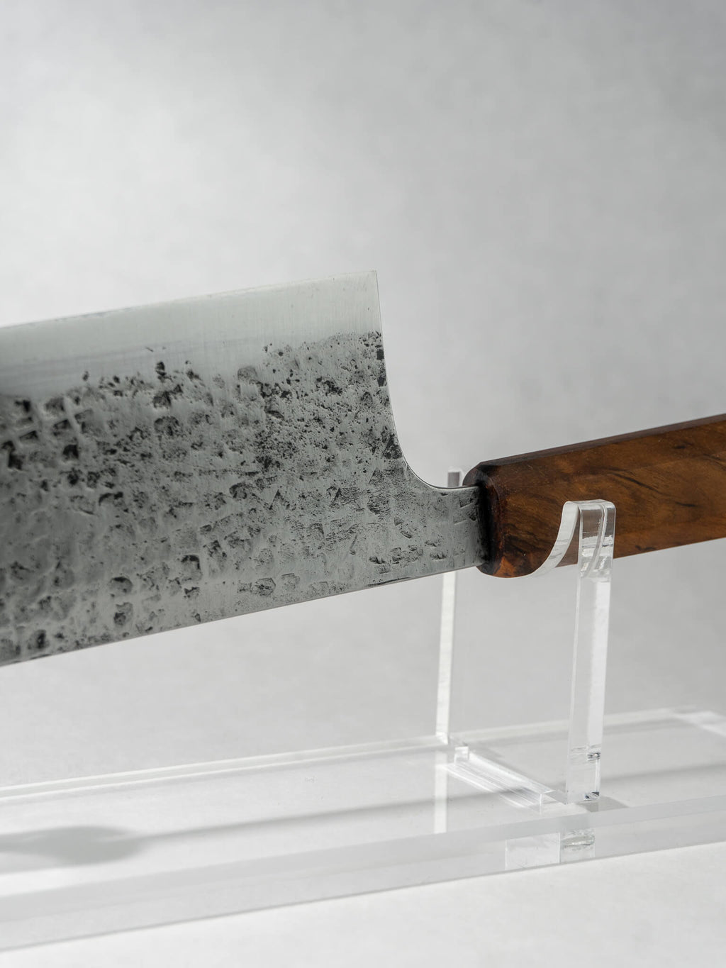 Close-up of hand-hammered tsuchime texture on Pisau Dapur Nakiri knife blade.
