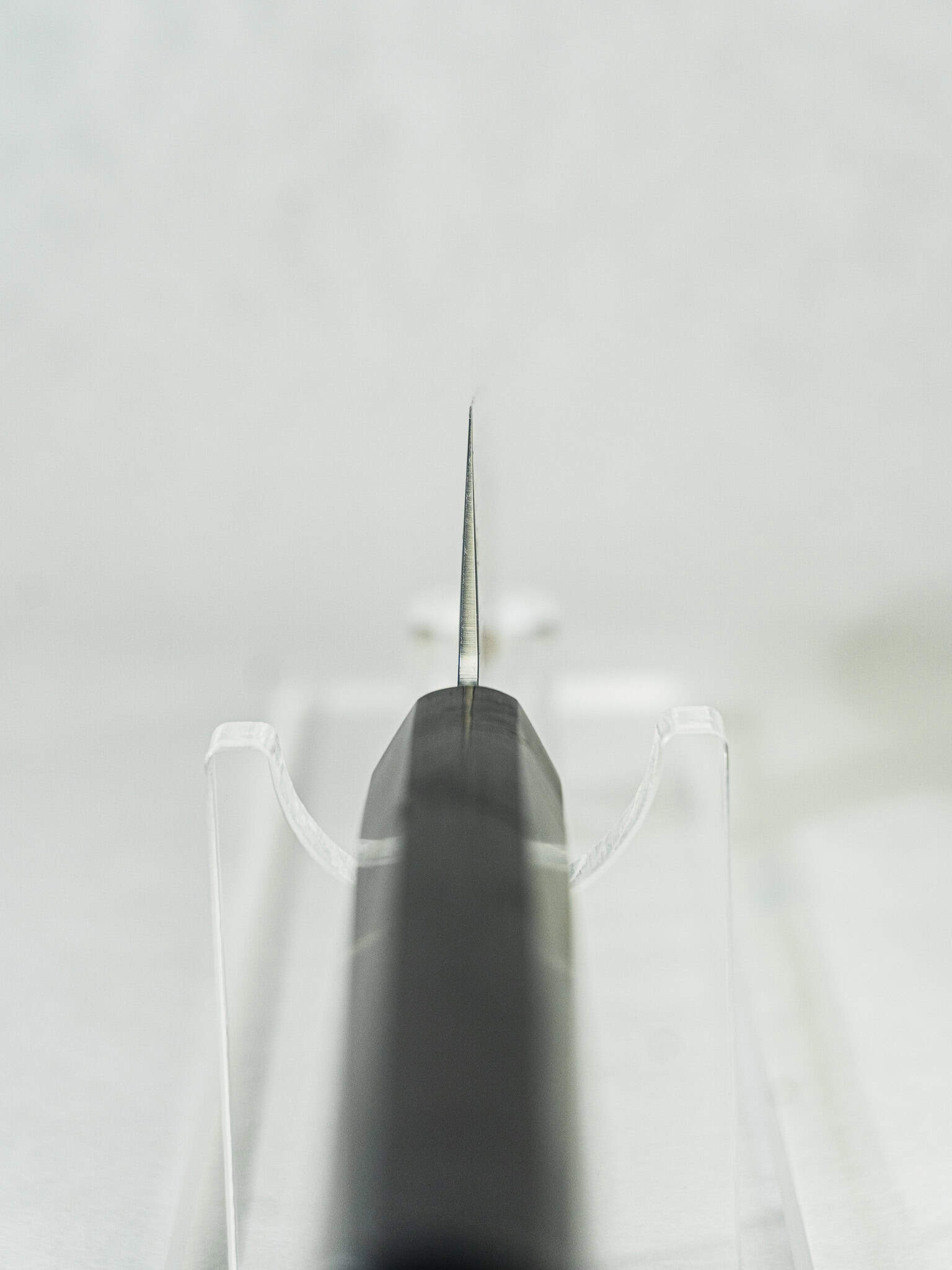 Close-up of Gyuto choil showing blade craftsmanship, geometry, and VG-10 core