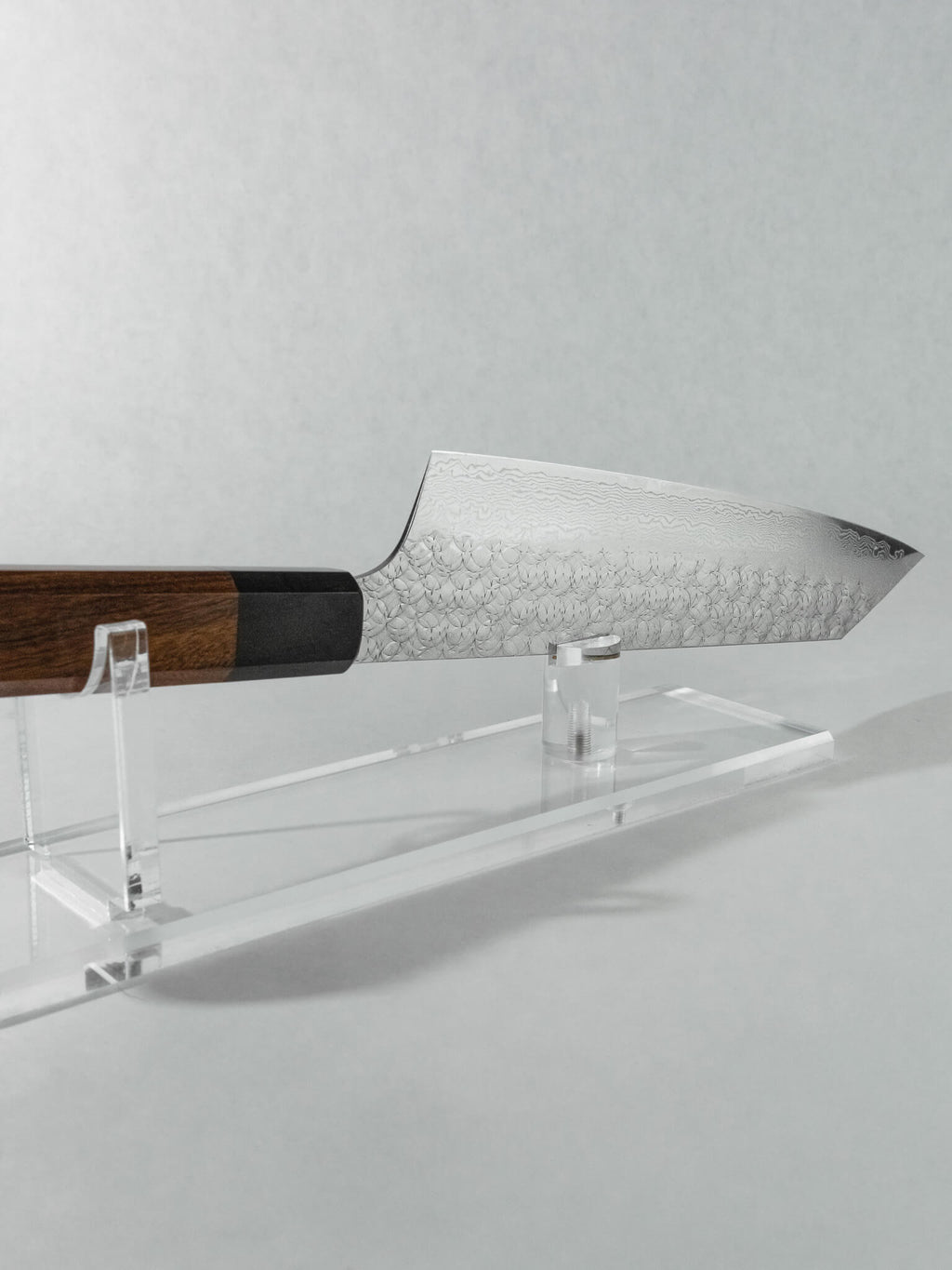 Side profile of Kengata knife showing sword-like blade shape.