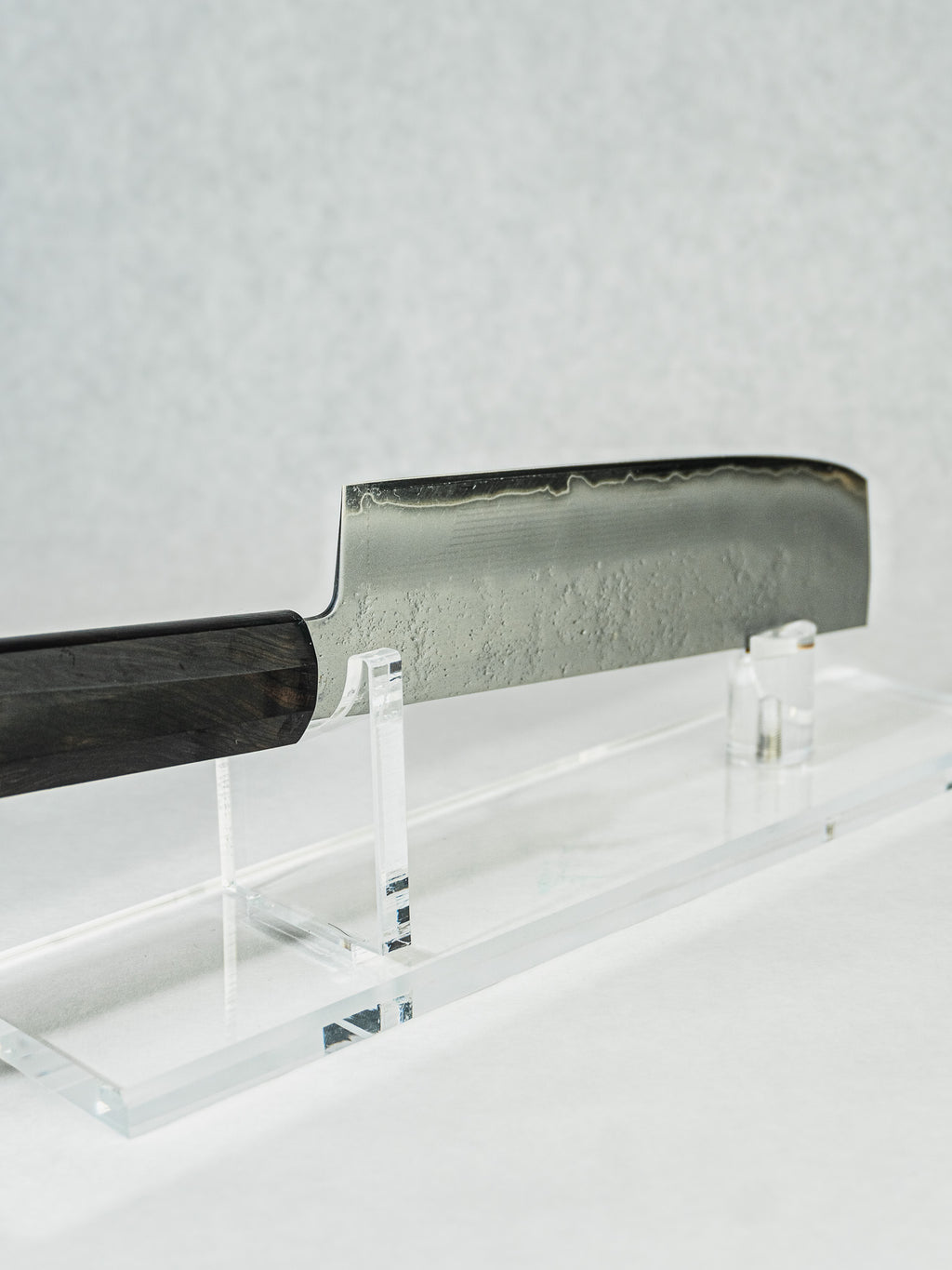 Sakai Takayuki nakiri knife with hammered blade finish and octagonal ebony wood handle.