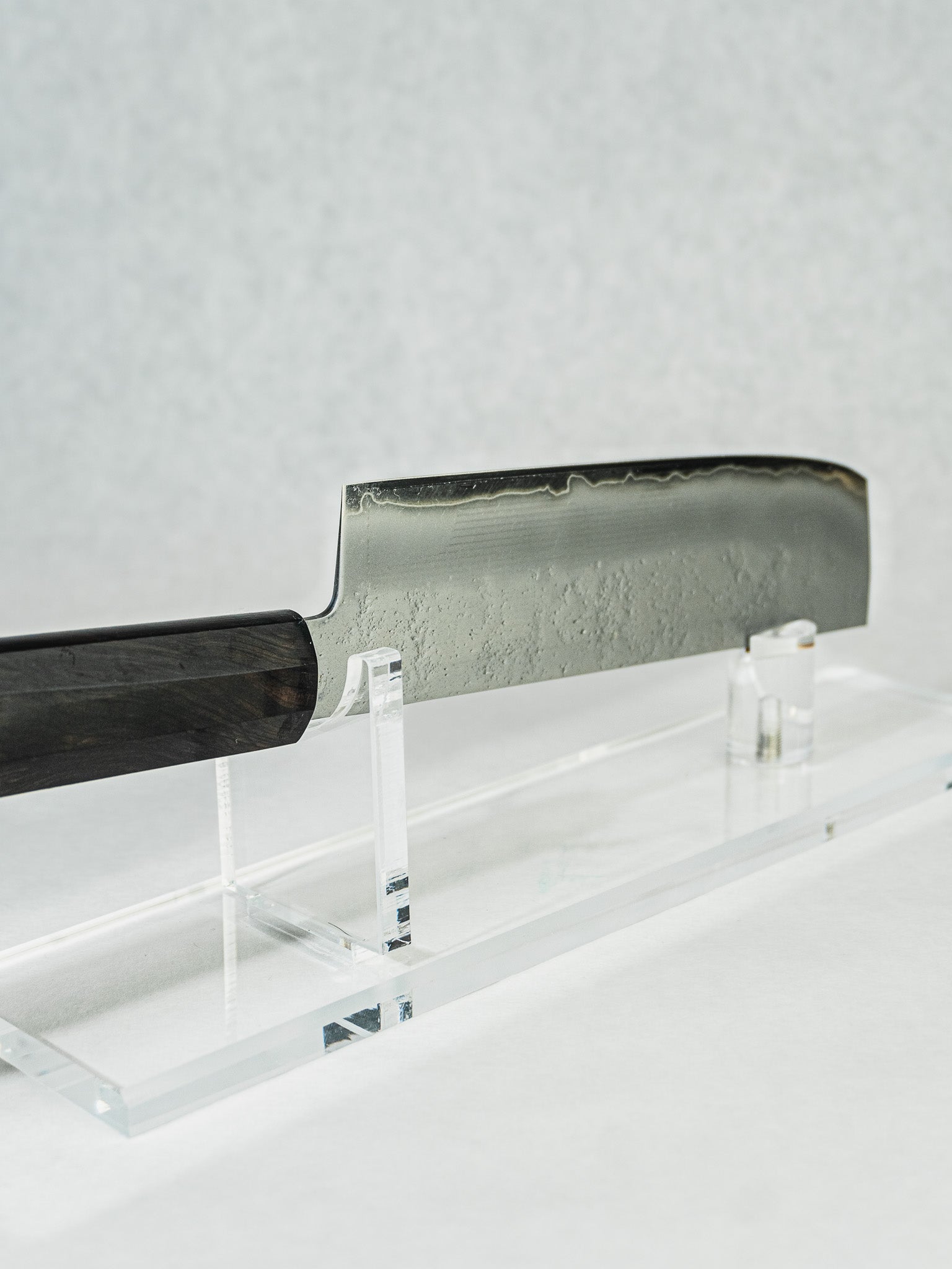 Sakai Takayuki nakiri knife with hammered blade finish and octagonal ebony wood handle.