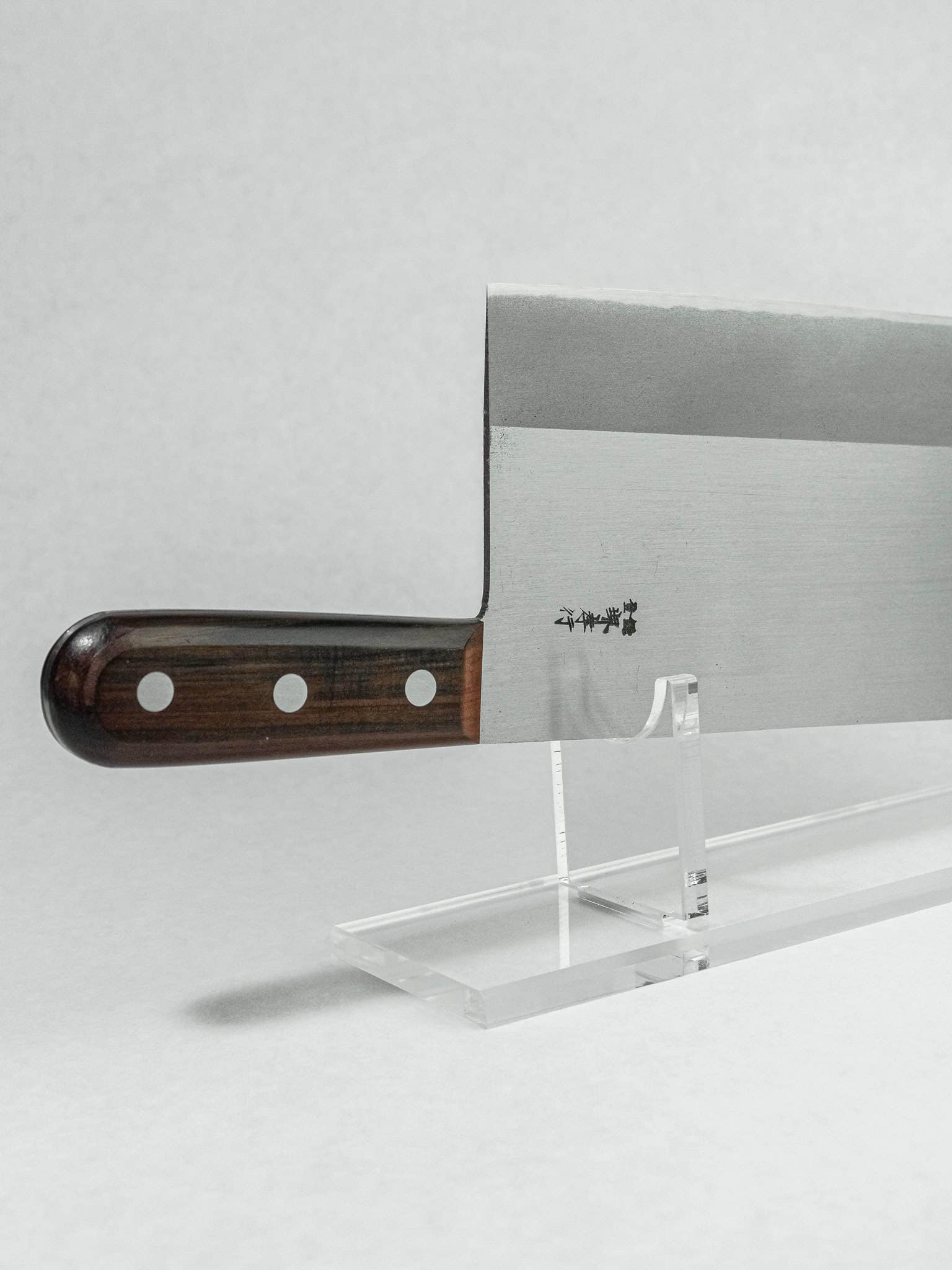 Rosewood handle on Sakai Takayuki cleaver, rounded for comfort.