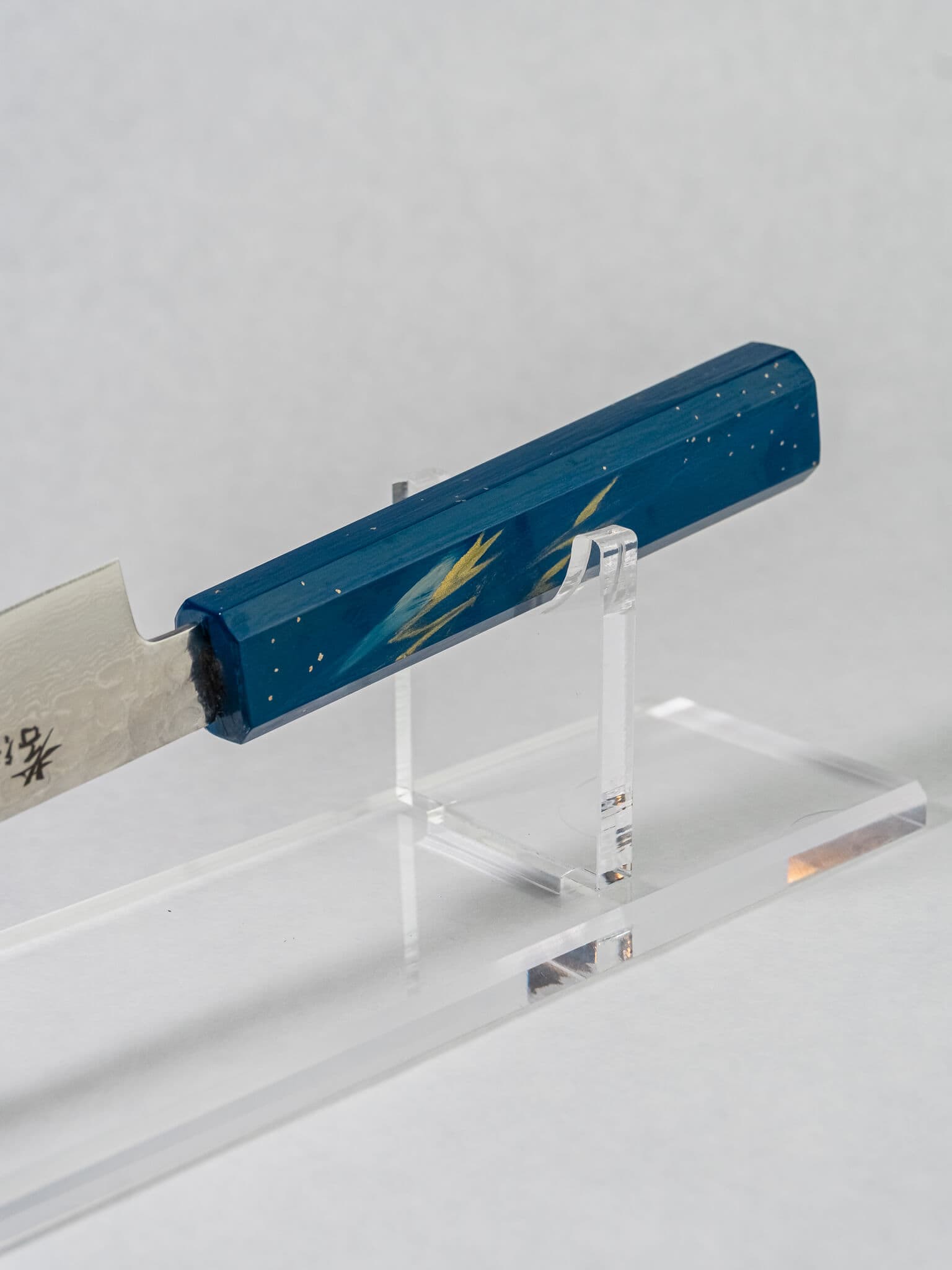 Artisan craftsmanship details of Sakai Takayuki Saiseki's hand painted and lacquered knife handle
