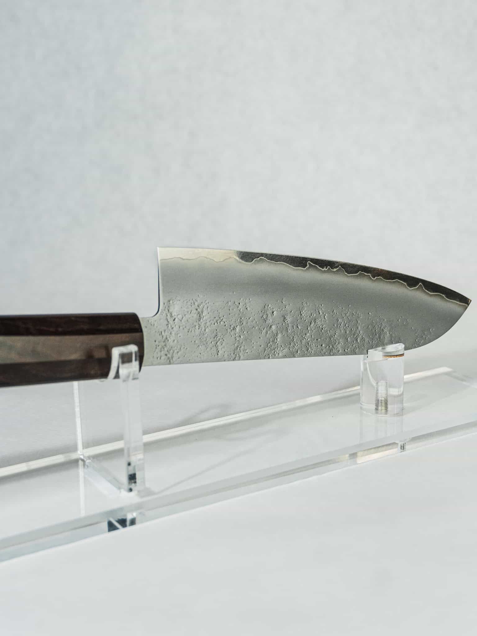 Close-up of Santoku blade highlighting nashiji pear-skin finish for improved food release