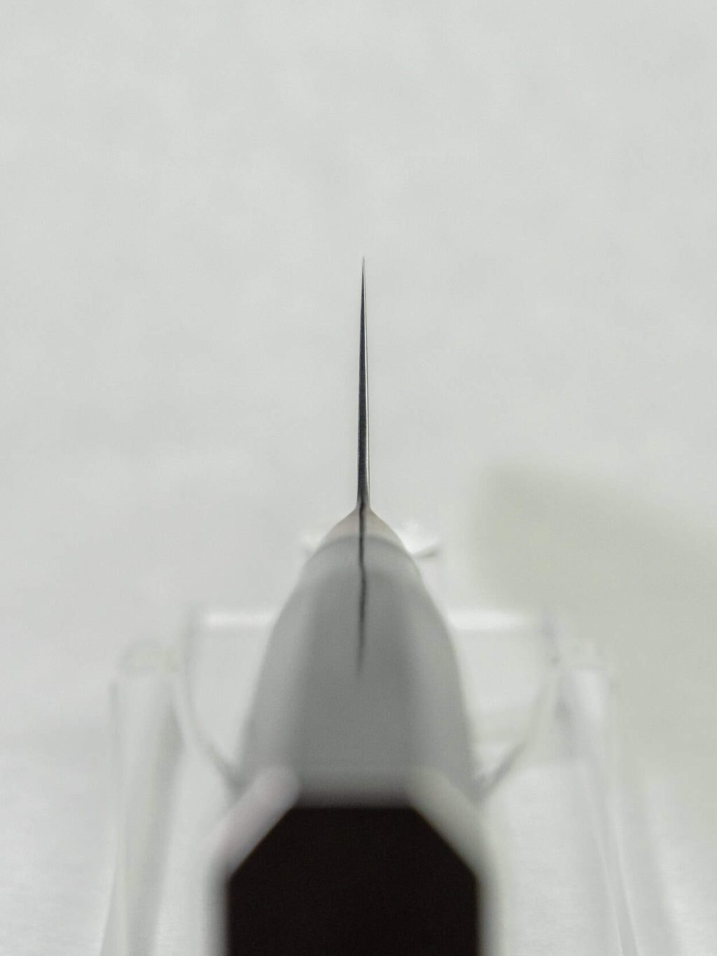 Balance point of Sakai Takayuki Gyuto 240mm showing the think grind.
