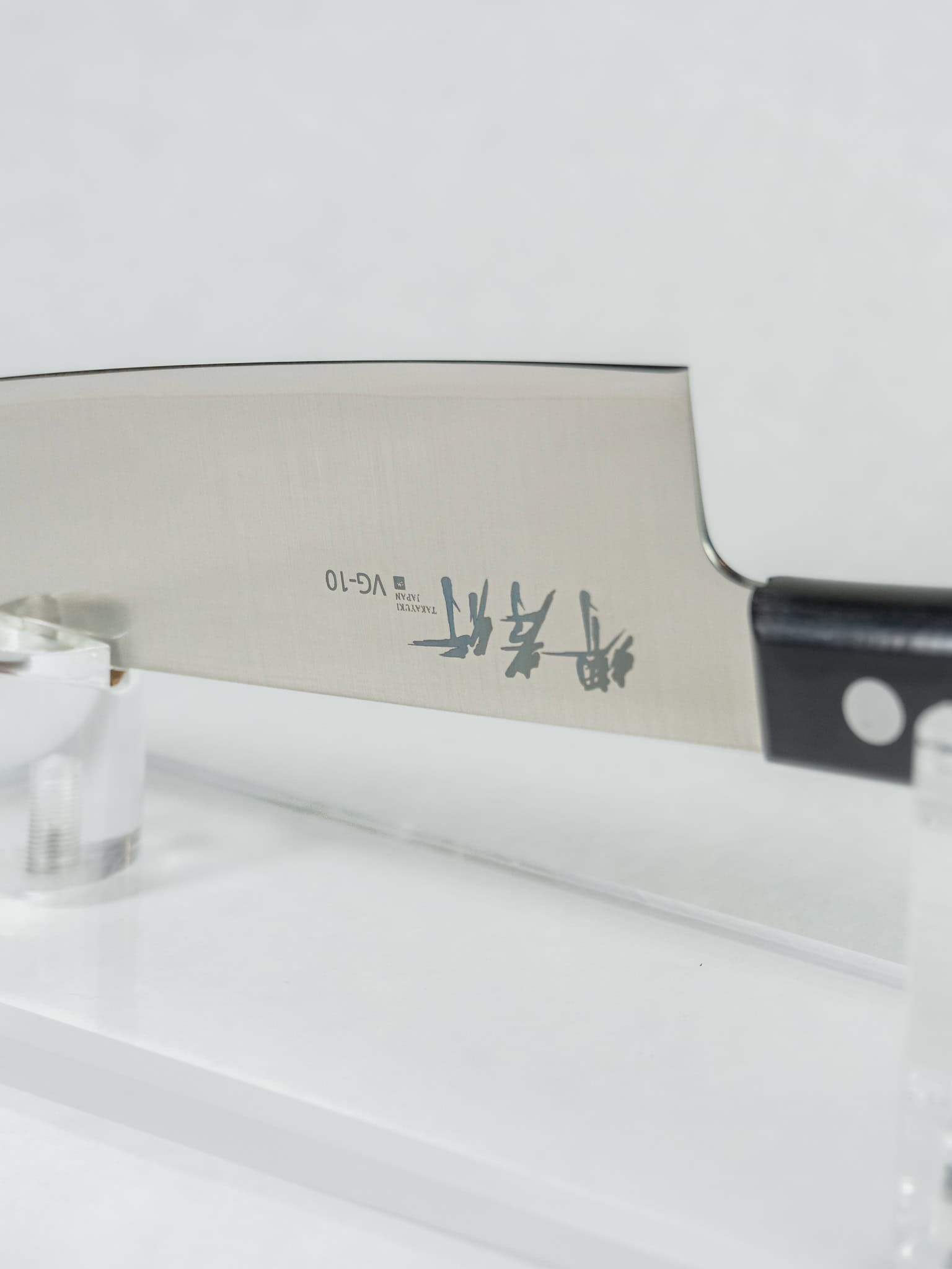 Razor sharp edge detail of Sumire Gyuto stainless steel knife