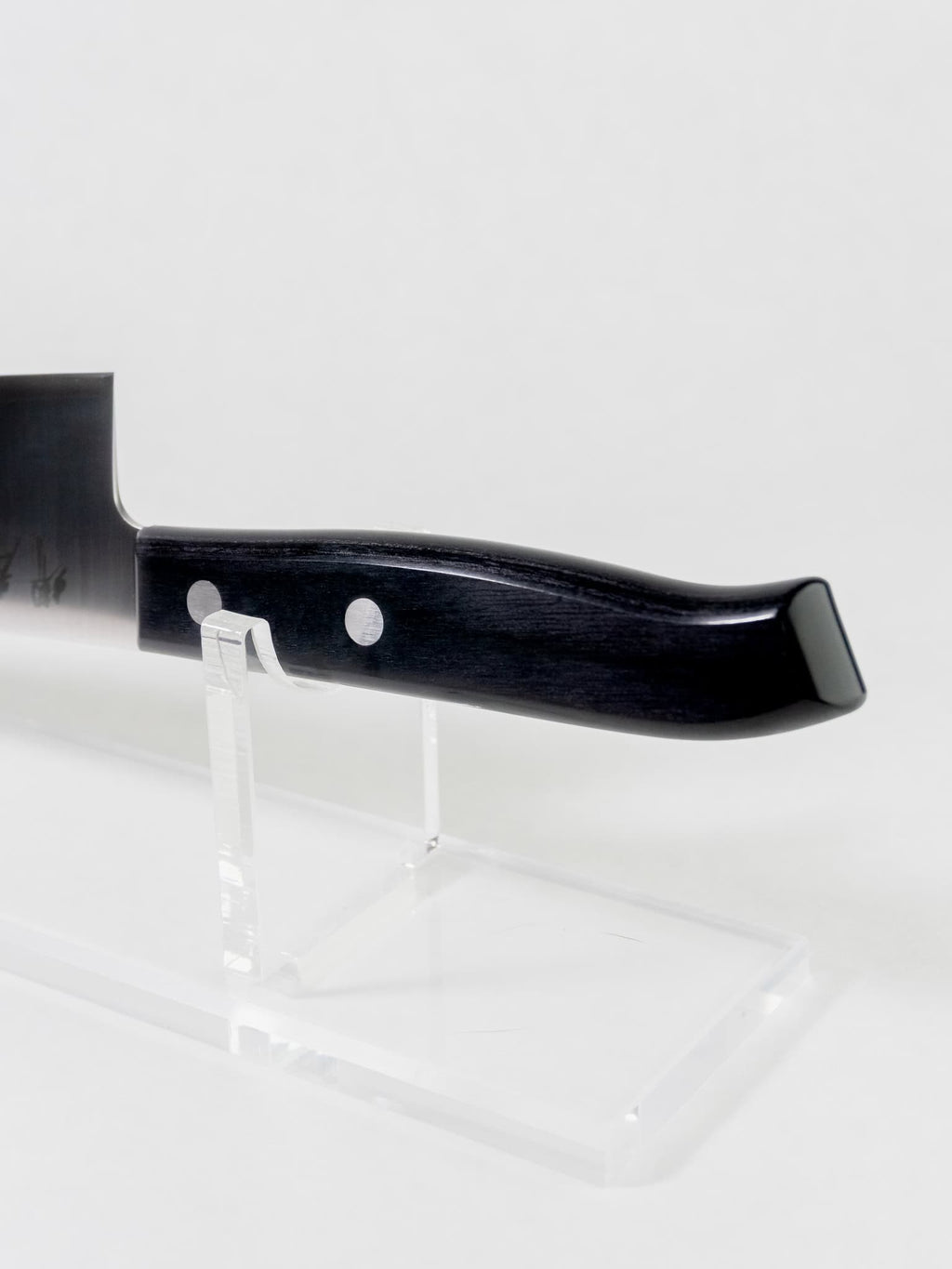 Black pakka wood handle on Sakai Takayuki Gyuto. Shaped to be ergonomic and comfortable. 