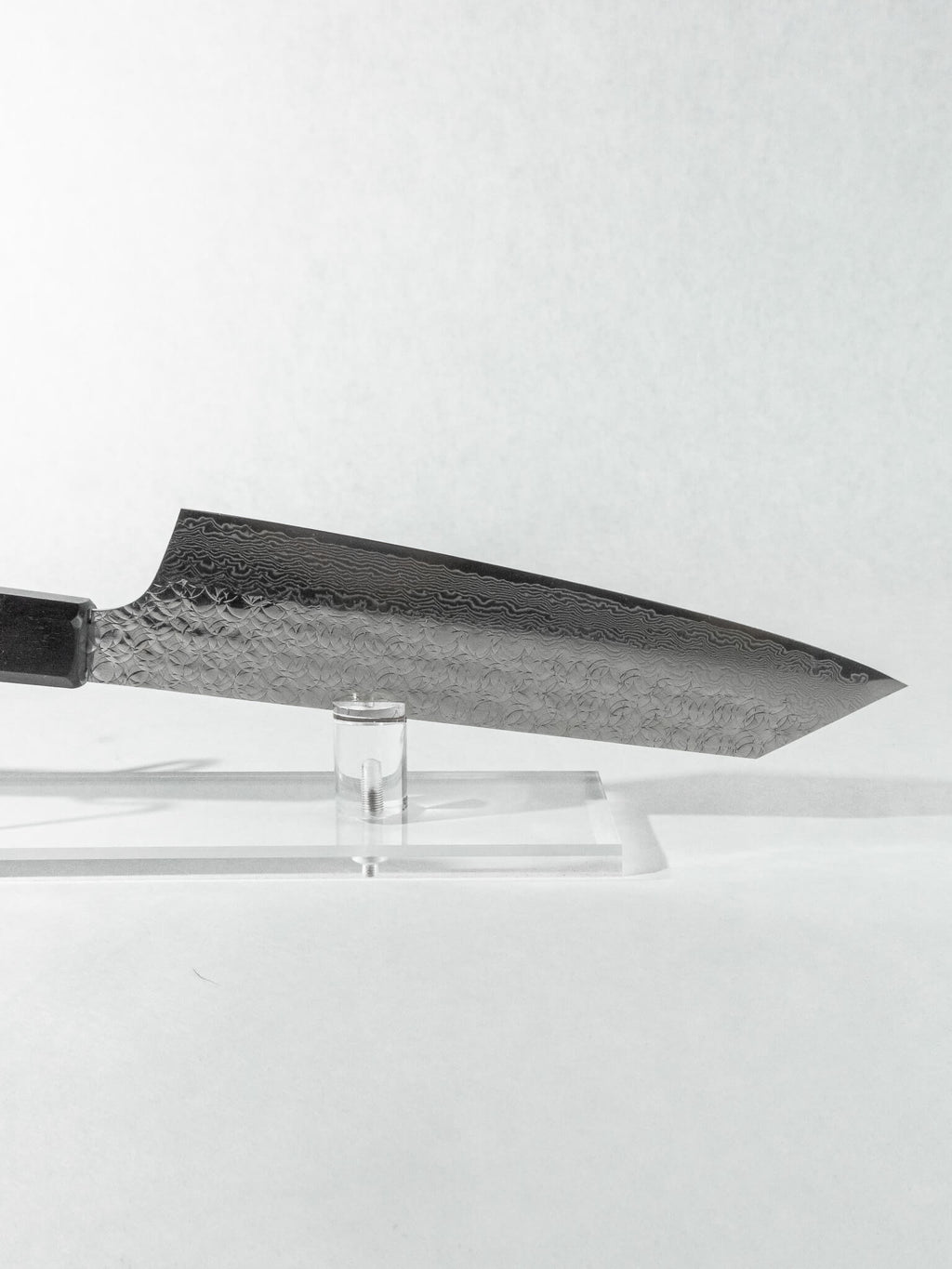 Stainless tsuchime damascus cladding with geometric hammering