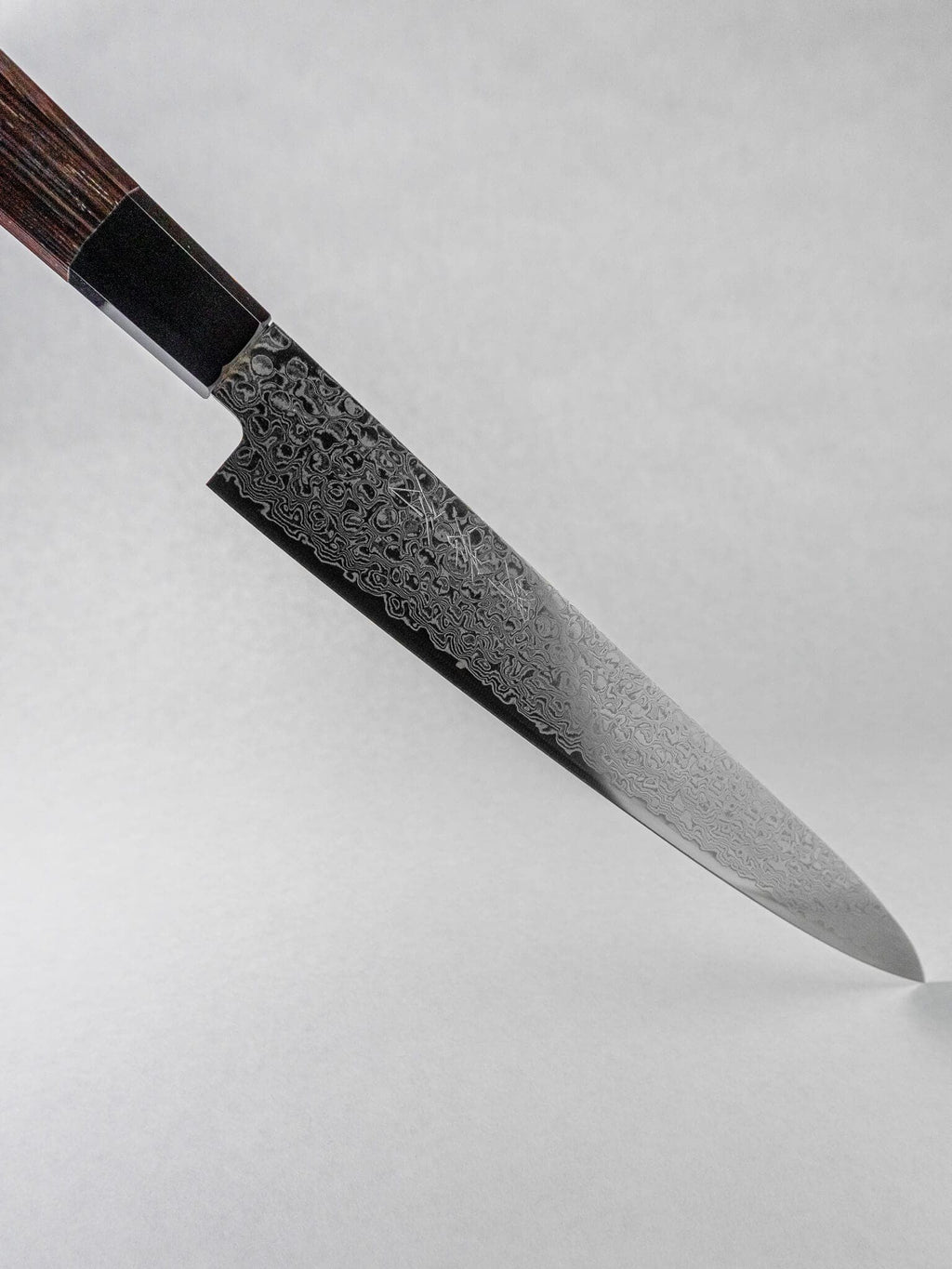 Detailed view of Sakai Takayuki ZA-18 Damascus blade finish