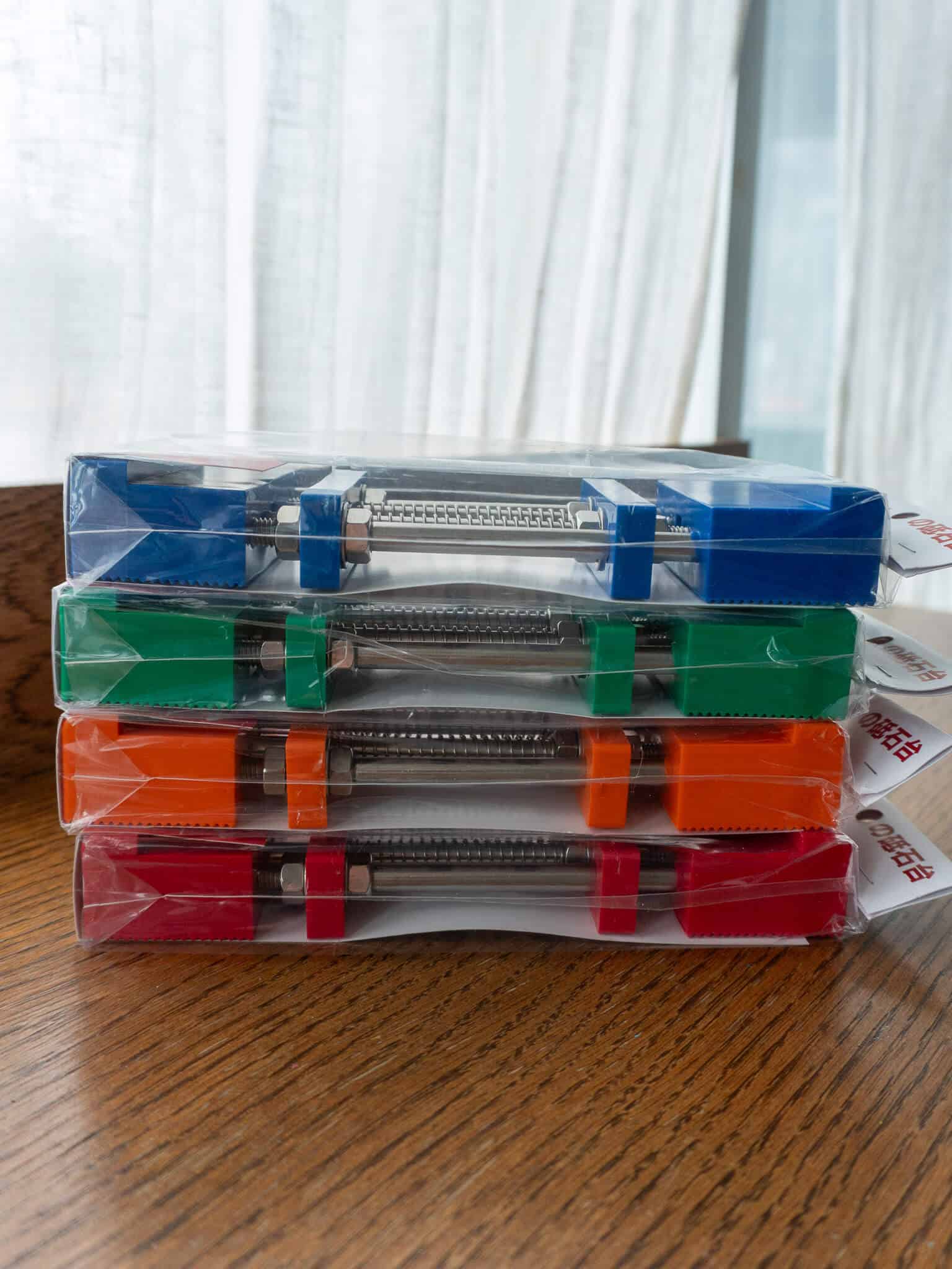 Blue, green, orange and red variations of the sharpening stone holders