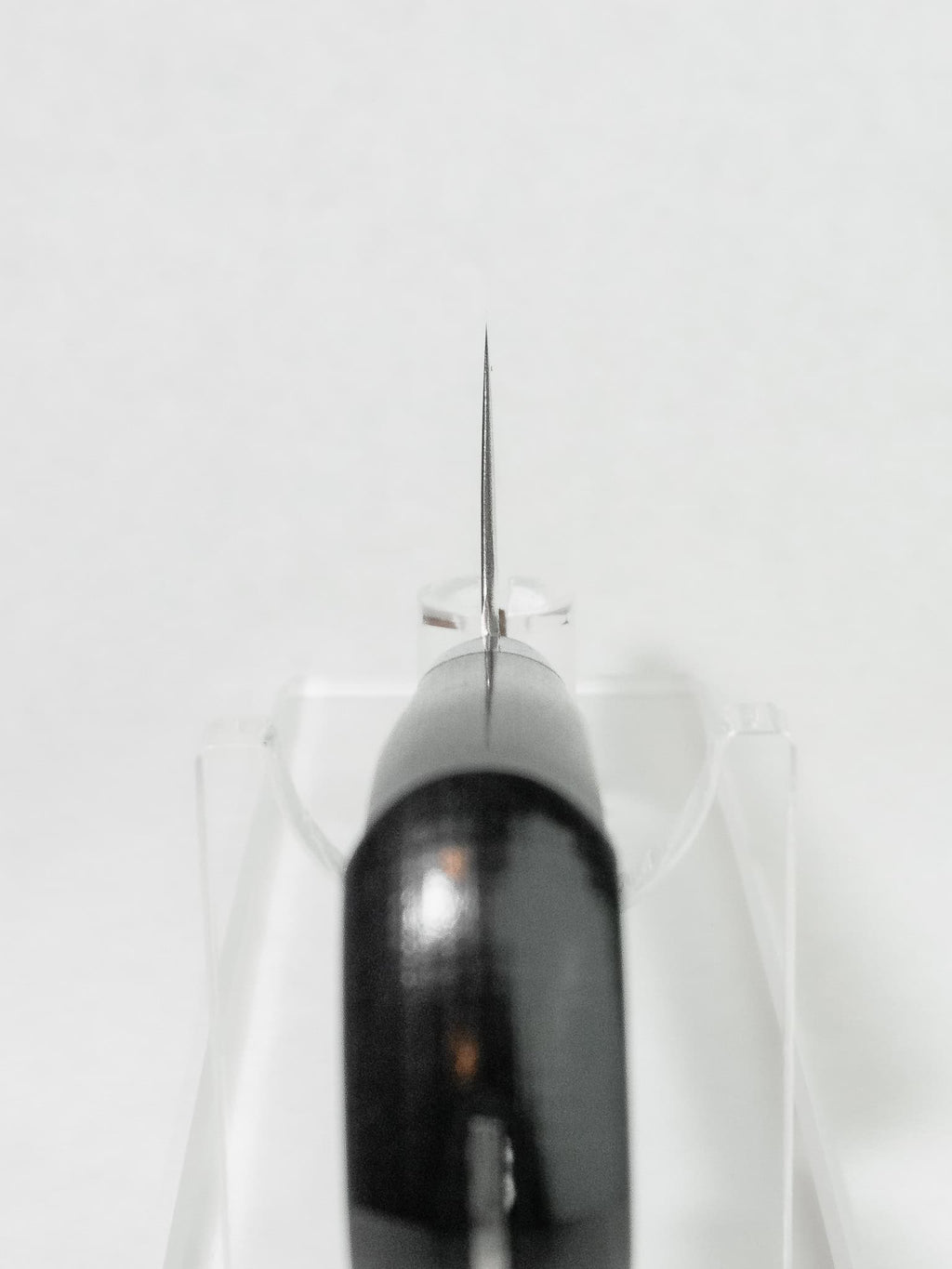 Choil view showing thin grind and comfort relief for the grip.