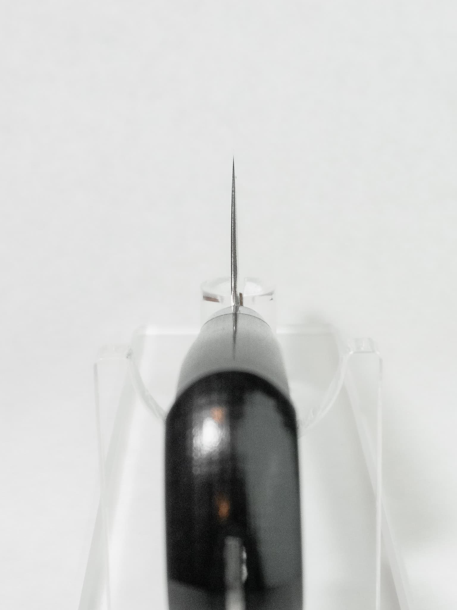 Choil view showing thin grind and comfort relief for the grip.