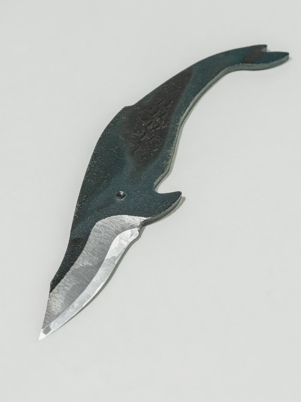 Thick spine and rigid blade on the whale shaped knife provide stability and a touch of whimsy for detailed work.