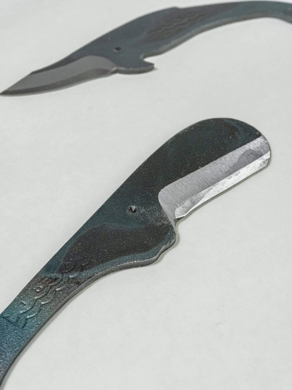 Whale-shaped Japanese utility knives made with SK5 steel. SK5 is a common Japanese tool steel.