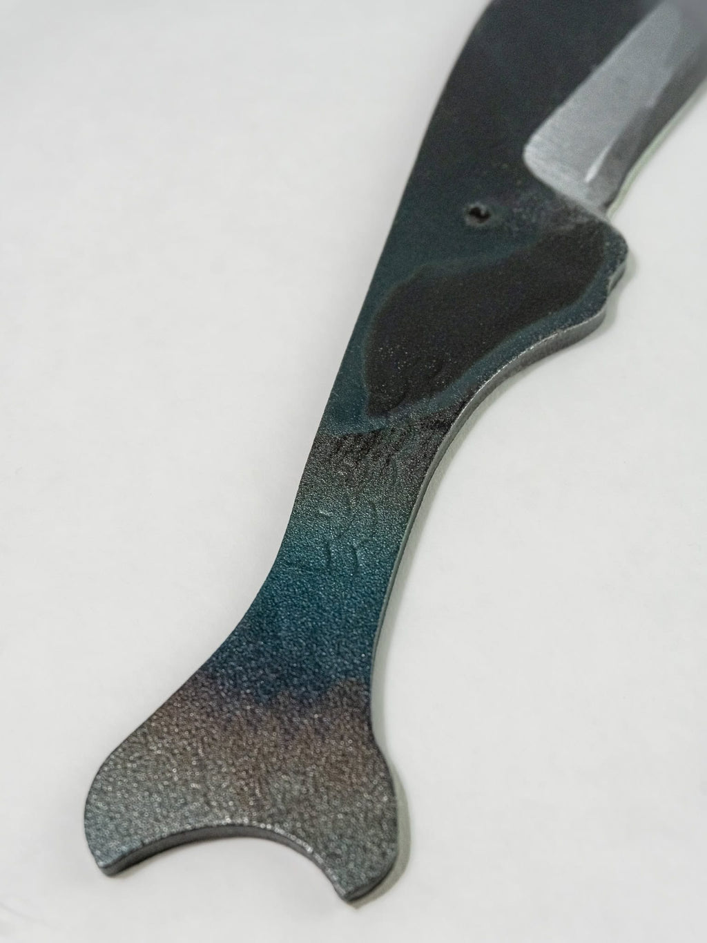 Close up of the hammering and colors on the Kogatana-style, Toru whale Japanese utility knife
